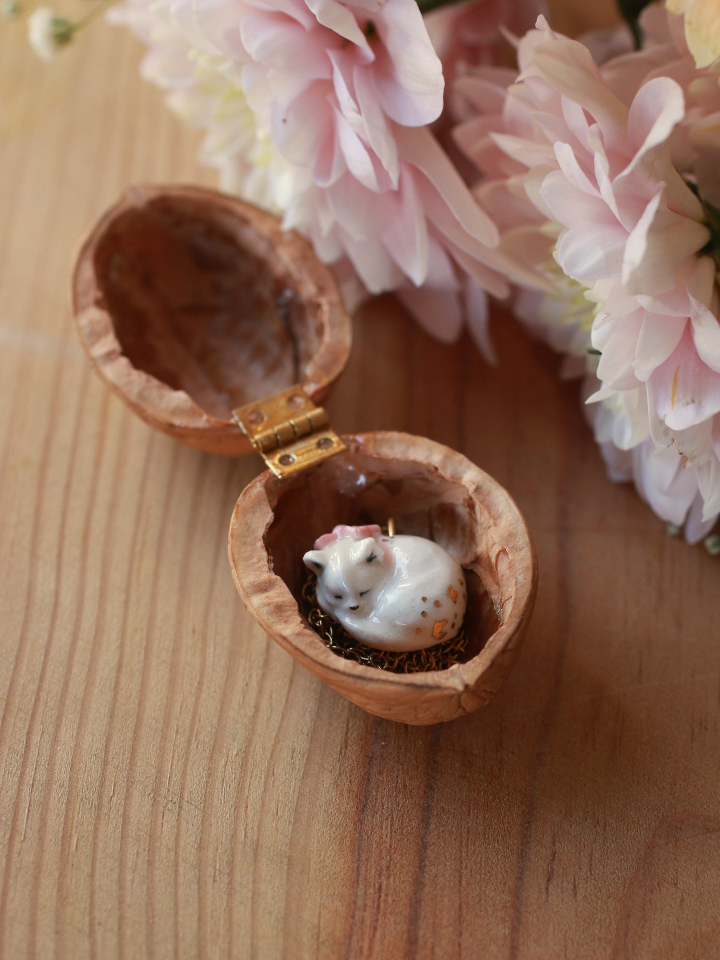Sleeping cat necklace in a walnut box