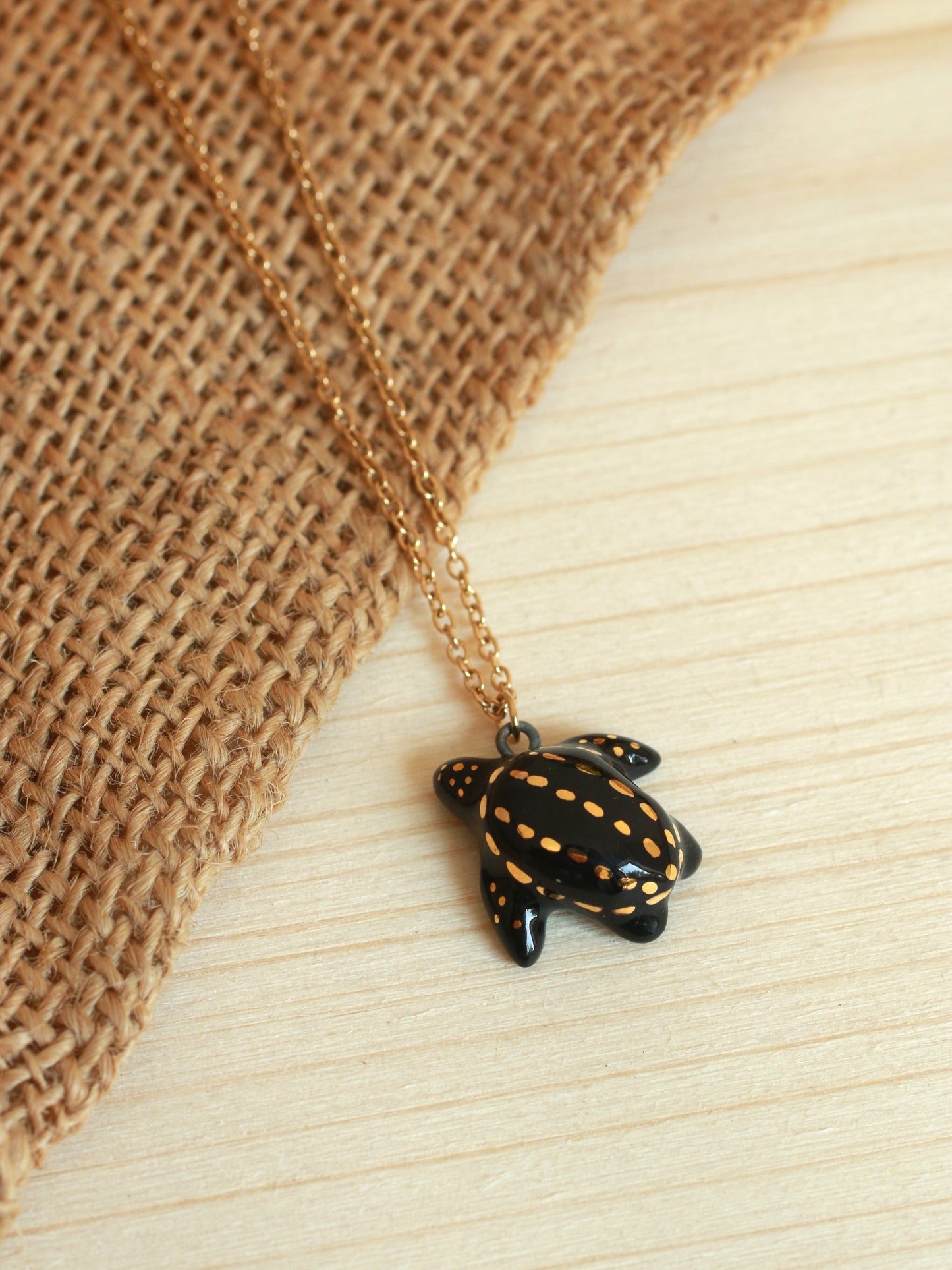 Ceramic black sea turtle necklace - with 22k gold details