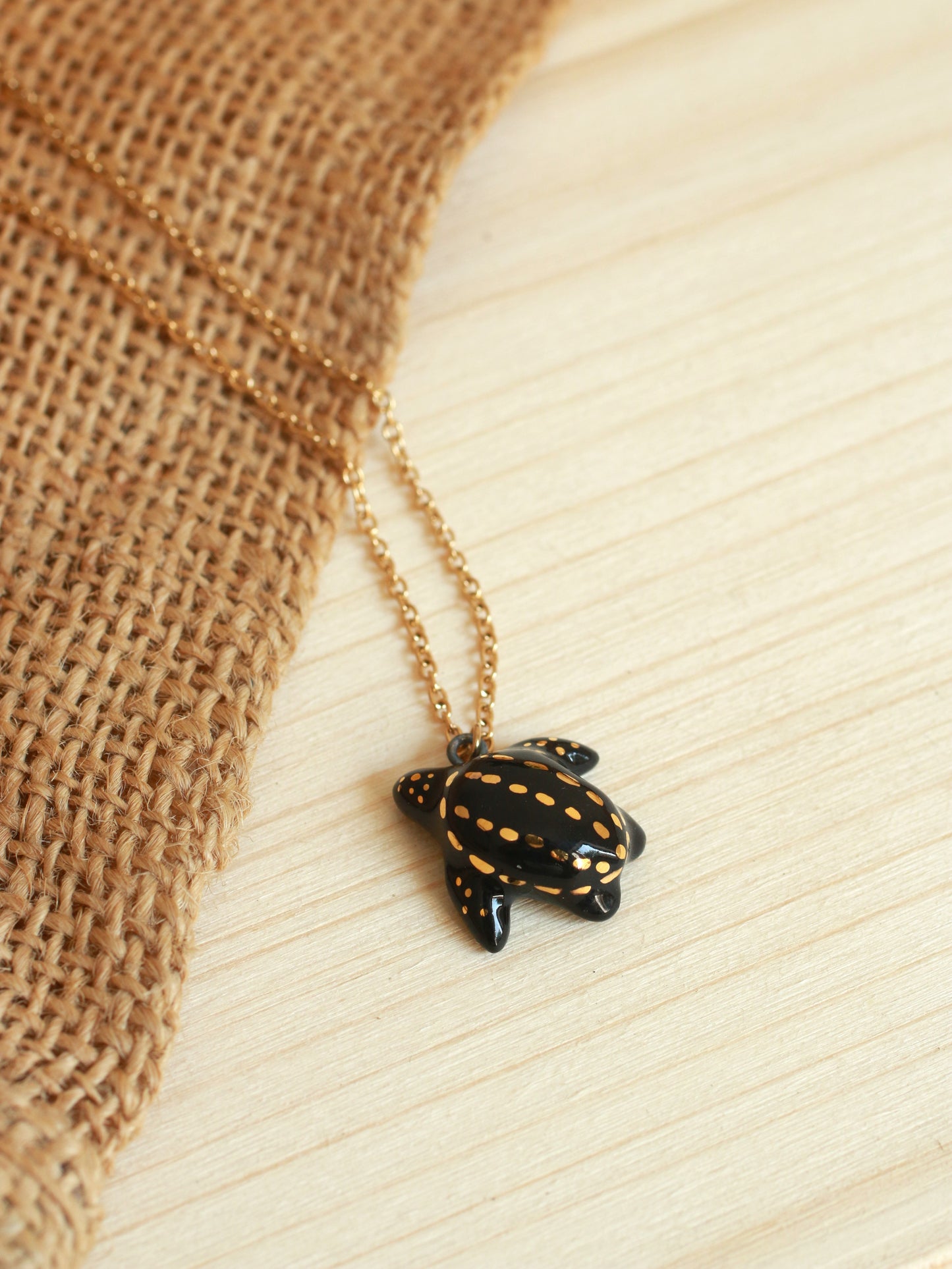 Ceramic black sea turtle necklace - with 22k gold details