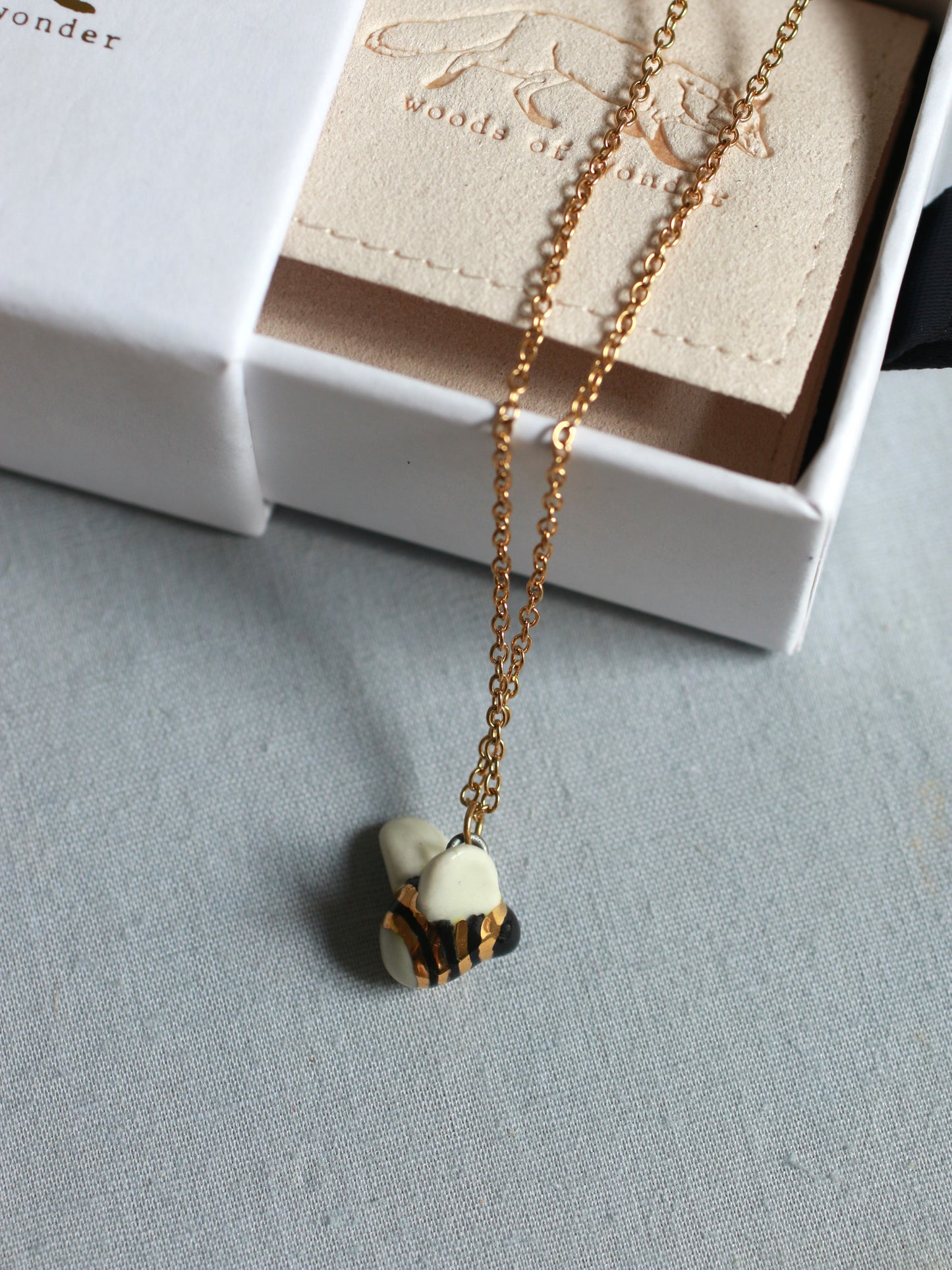 Ceramic bee necklace - 22k gold details