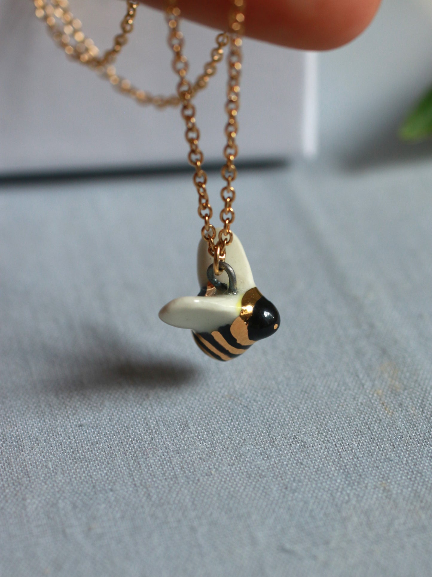 Ceramic bee necklace - 22k gold details