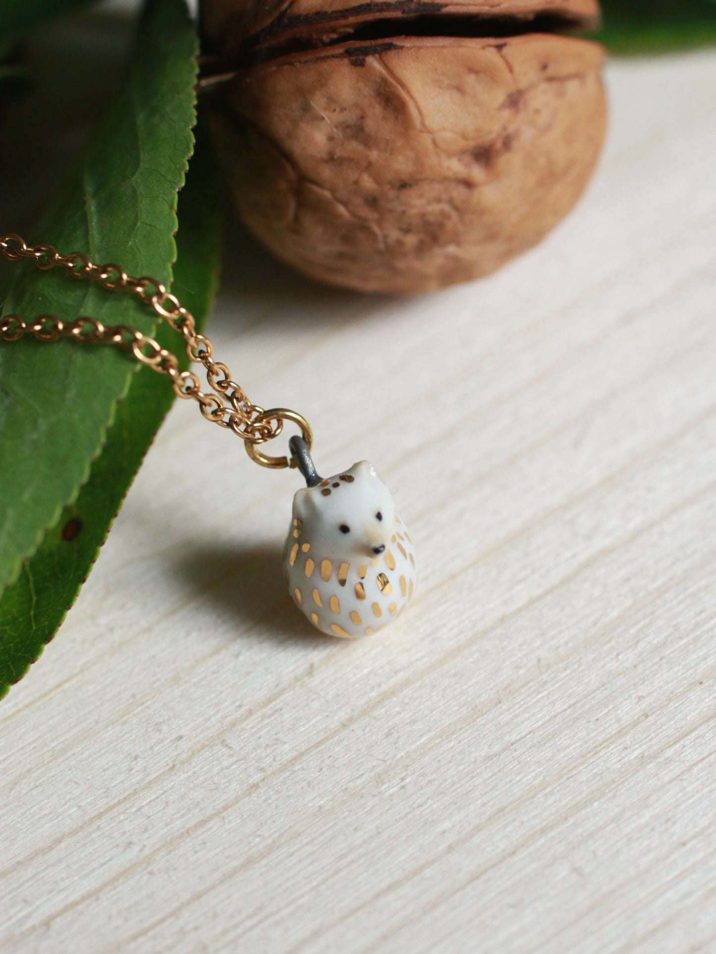 Ceramic Hedgehog necklace in a walnut box - 22k gold details
