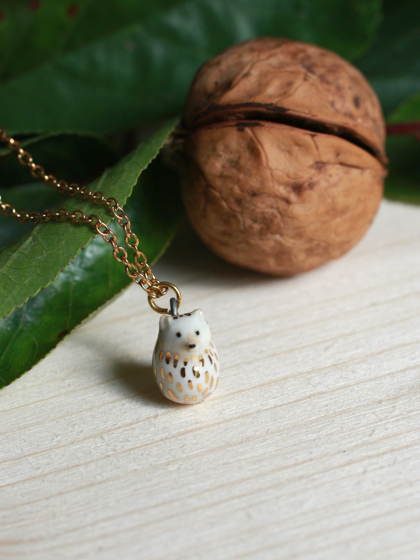 Ceramic Hedgehog necklace in a walnut box - 22k gold details