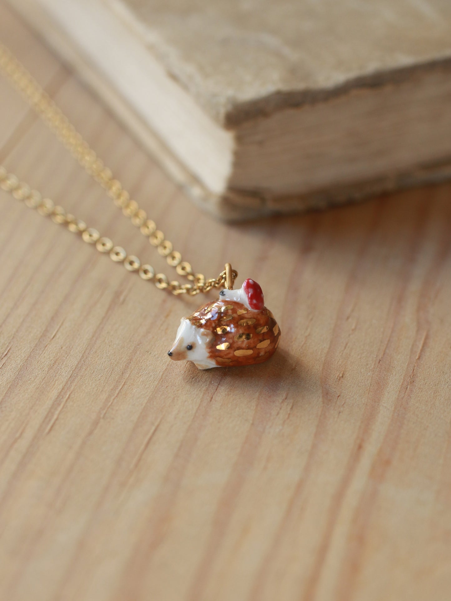 Hedgehog necklace with a tiny mushroom