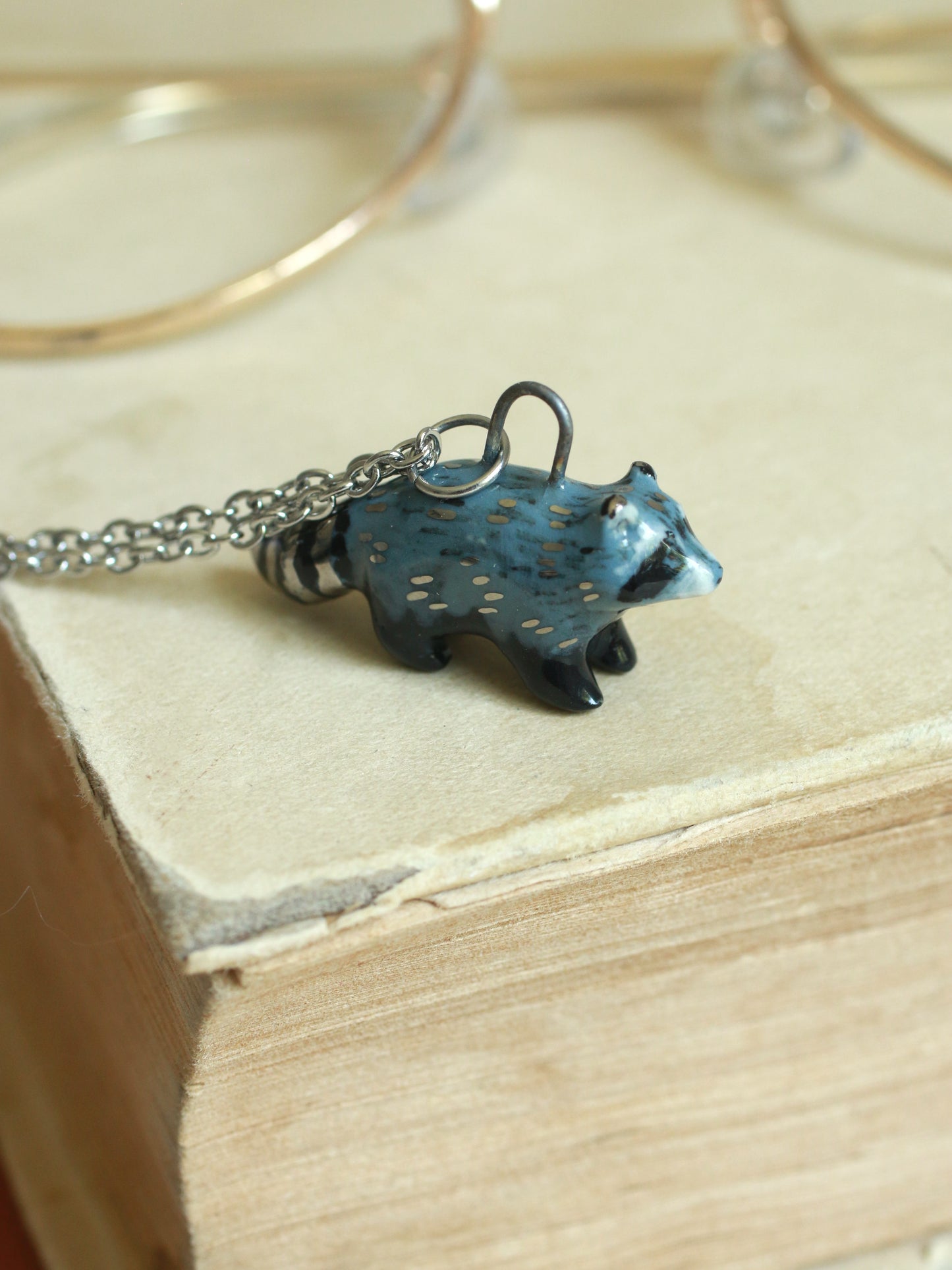 Ceramic raccoon necklace - silver details