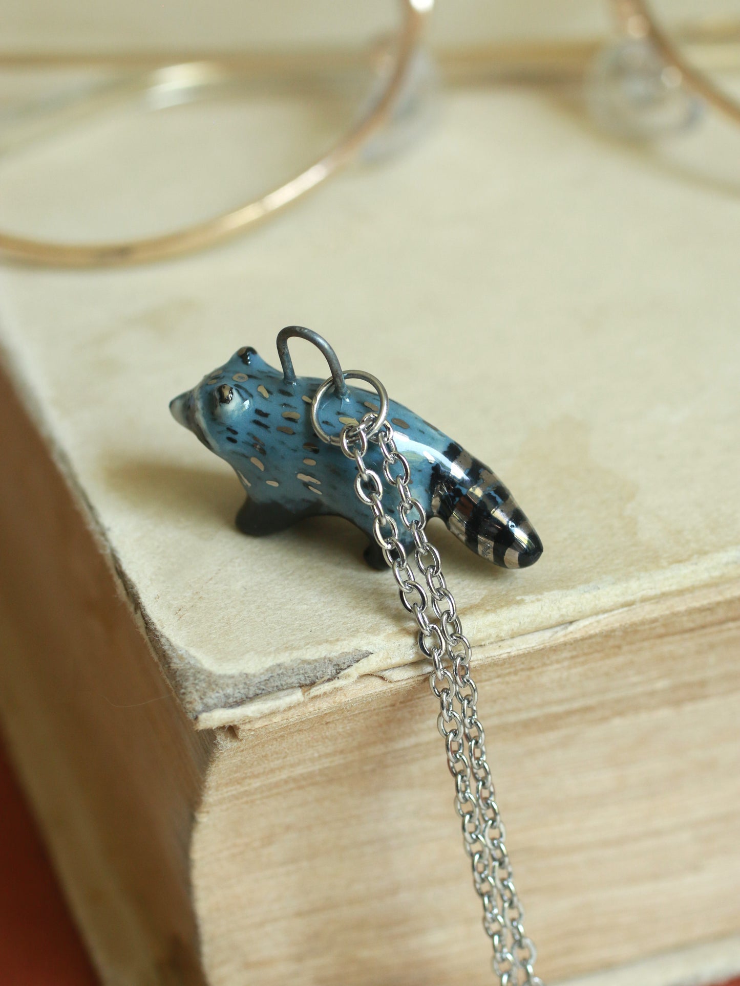 Ceramic raccoon necklace - silver details