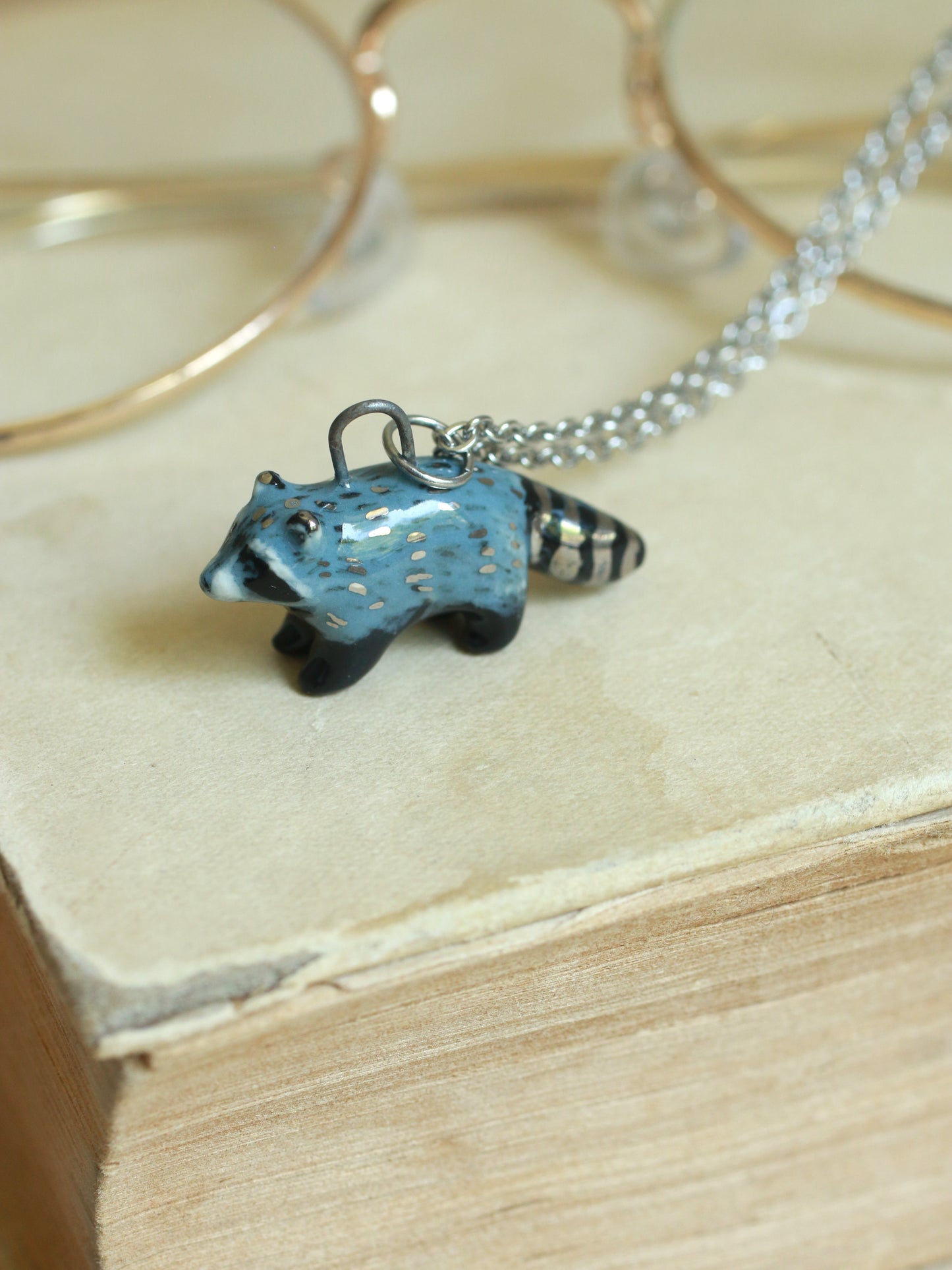 Ceramic raccoon necklace - silver details
