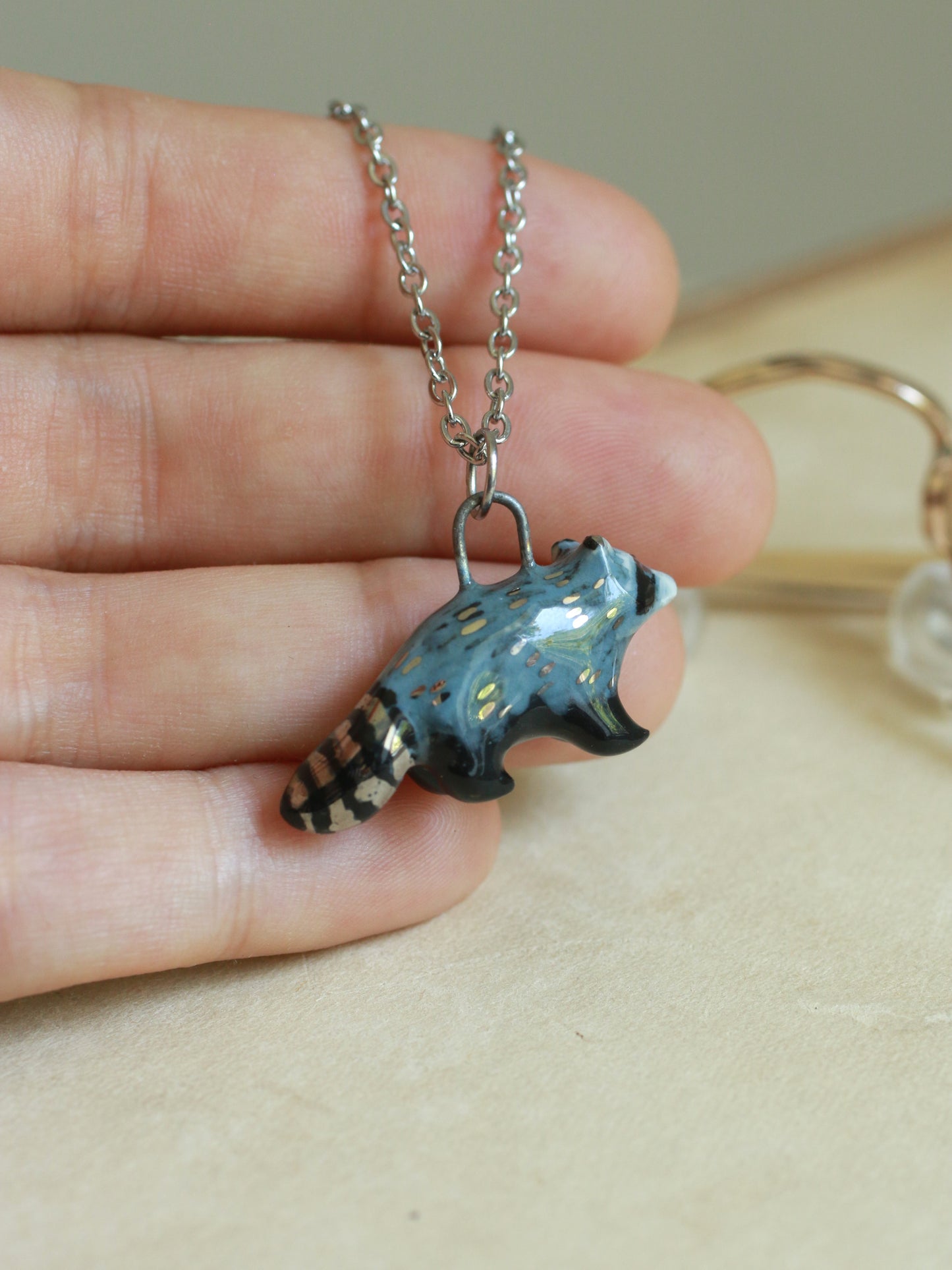 Ceramic raccoon necklace - silver details
