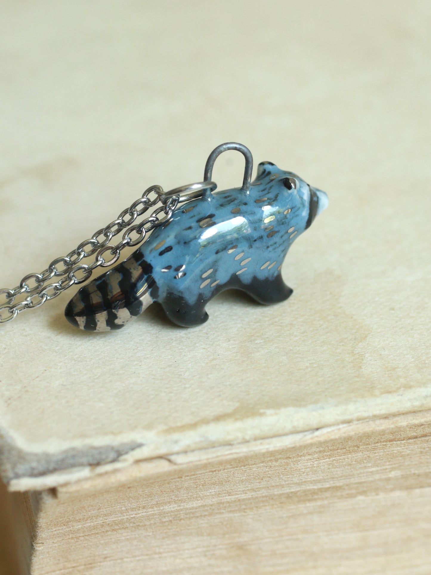 Ceramic raccoon necklace - silver details