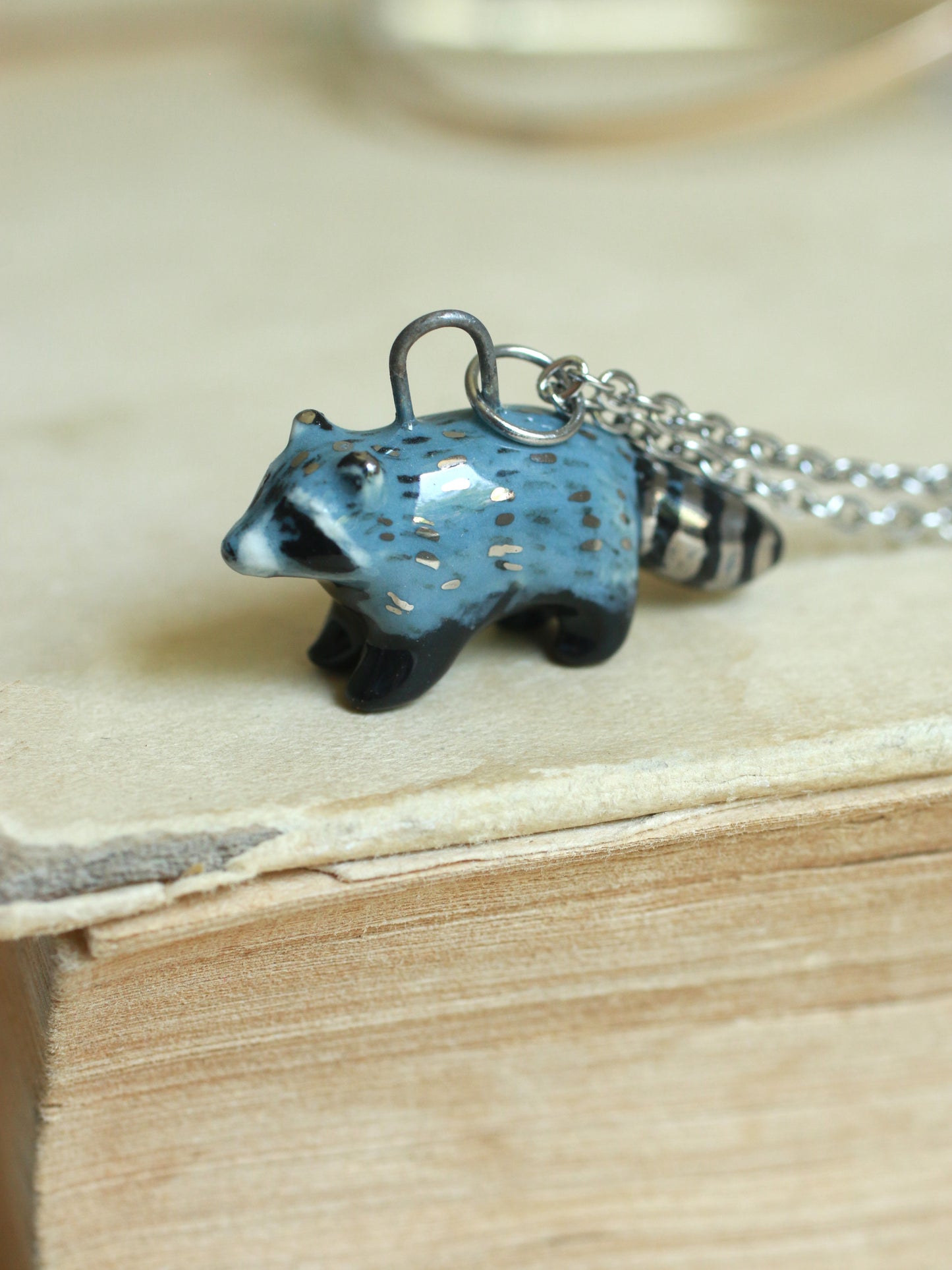 Ceramic raccoon necklace - silver details