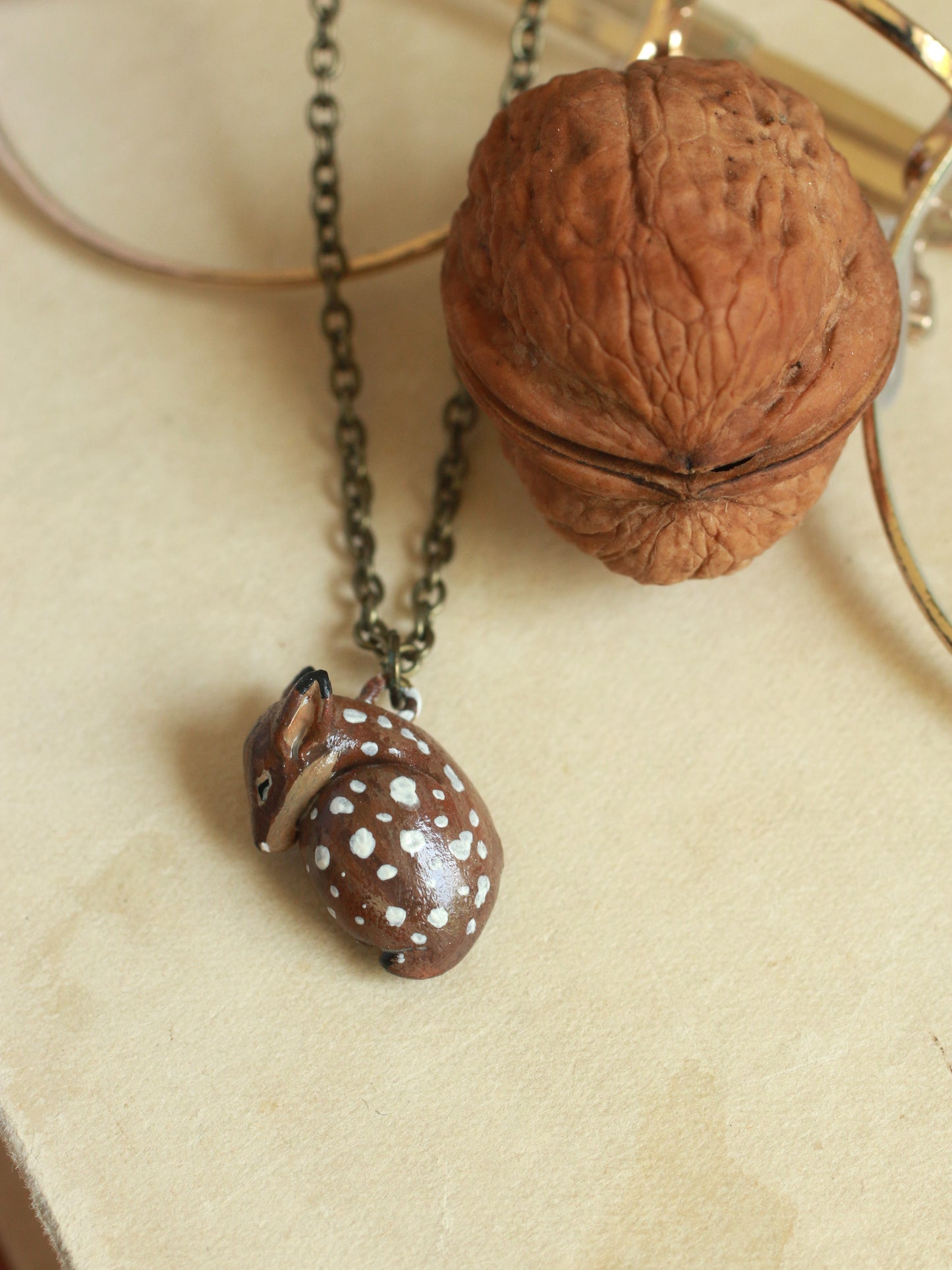 Sleeping Fawn necklace in a walnut box