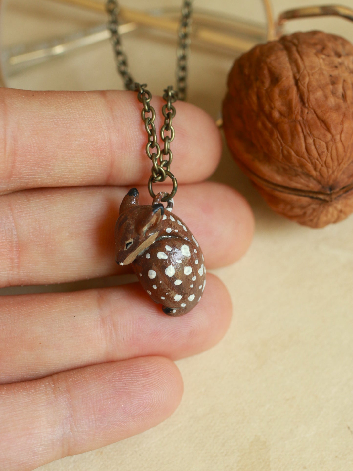 Sleeping Fawn necklace in a walnut box
