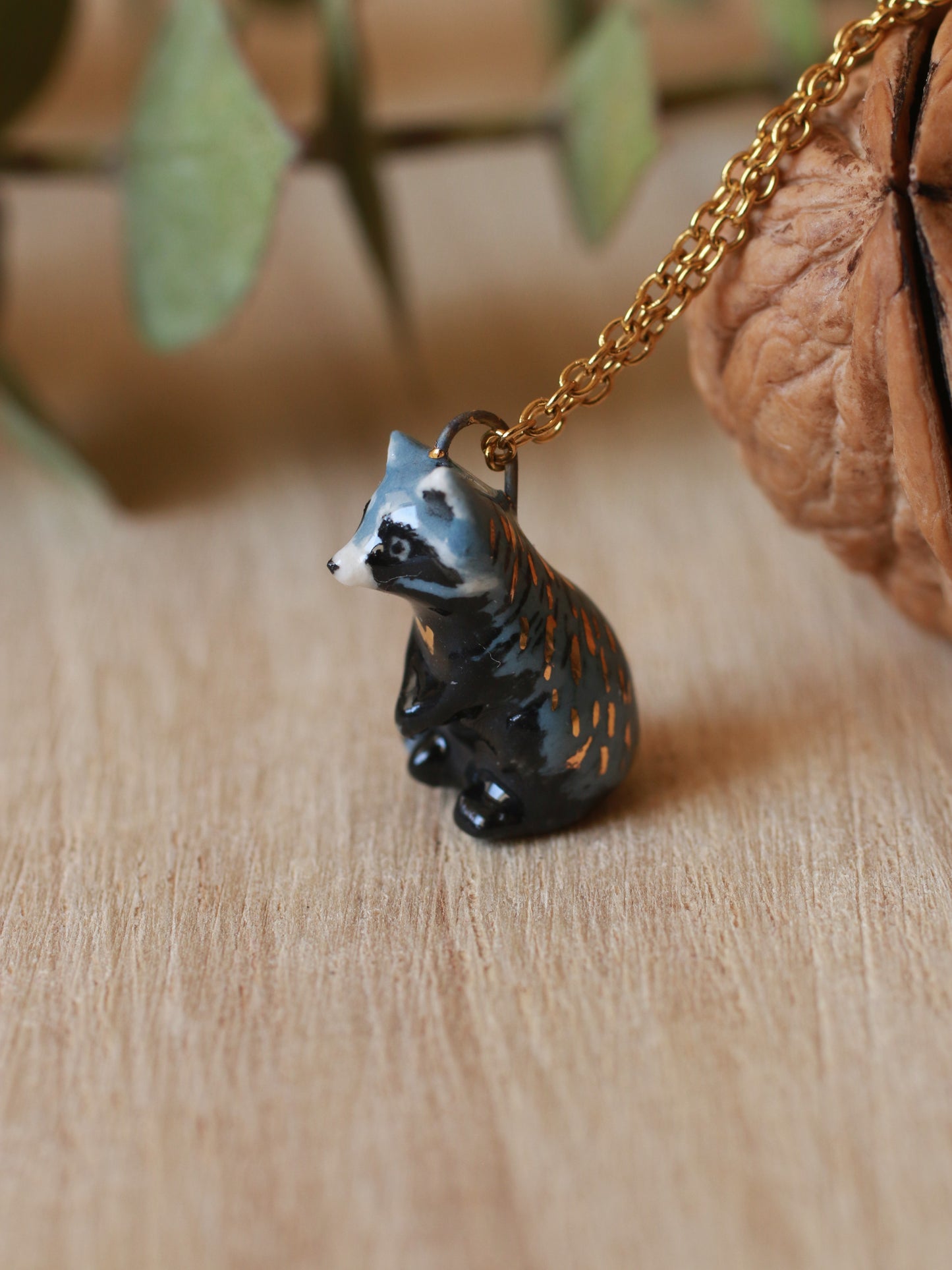 Raccoon necklace in a nutshell box