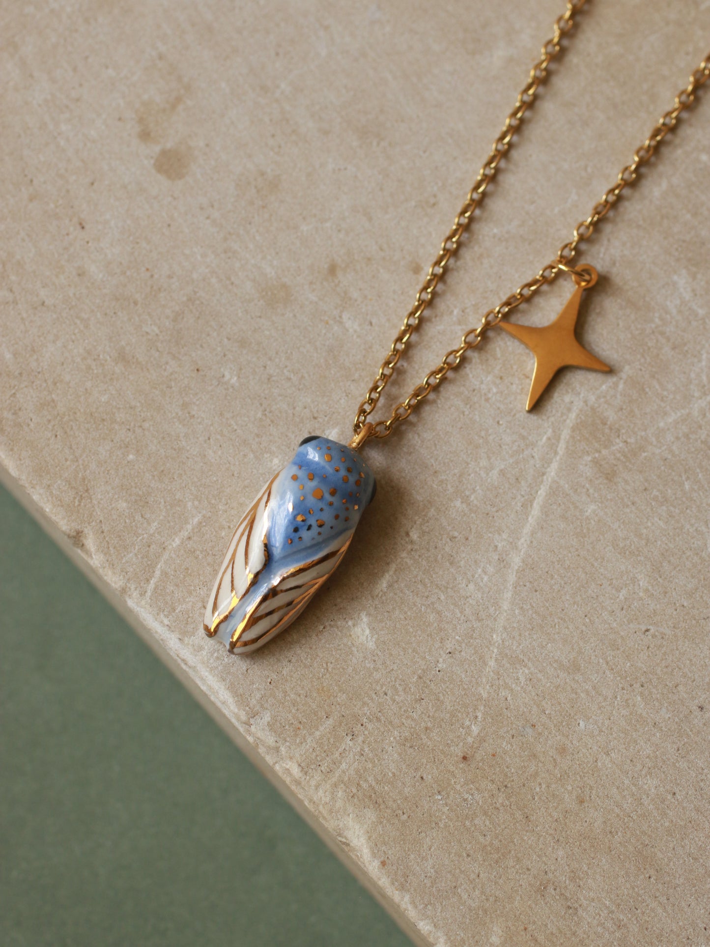Blue cicada necklace