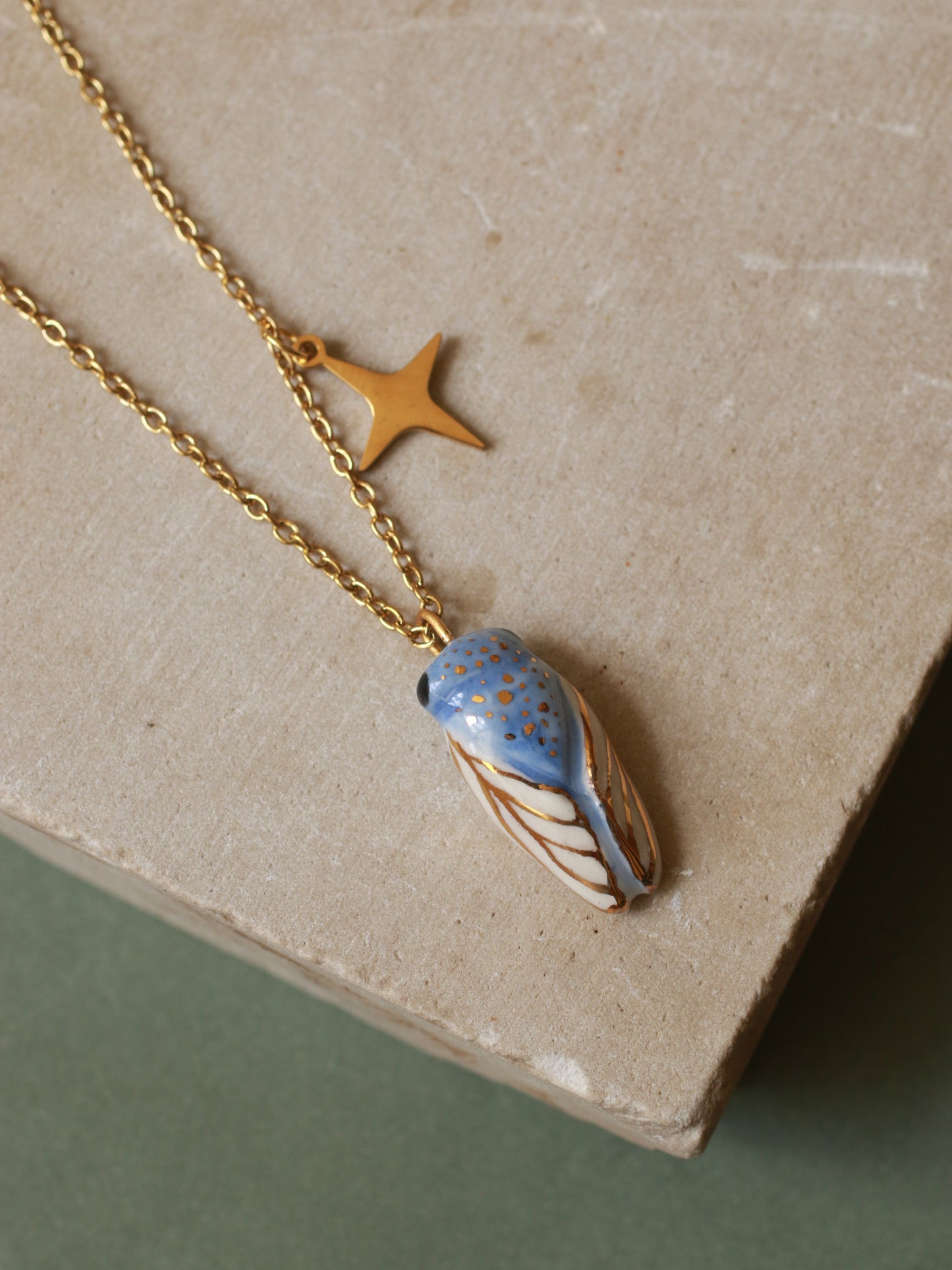 Blue cicada necklace