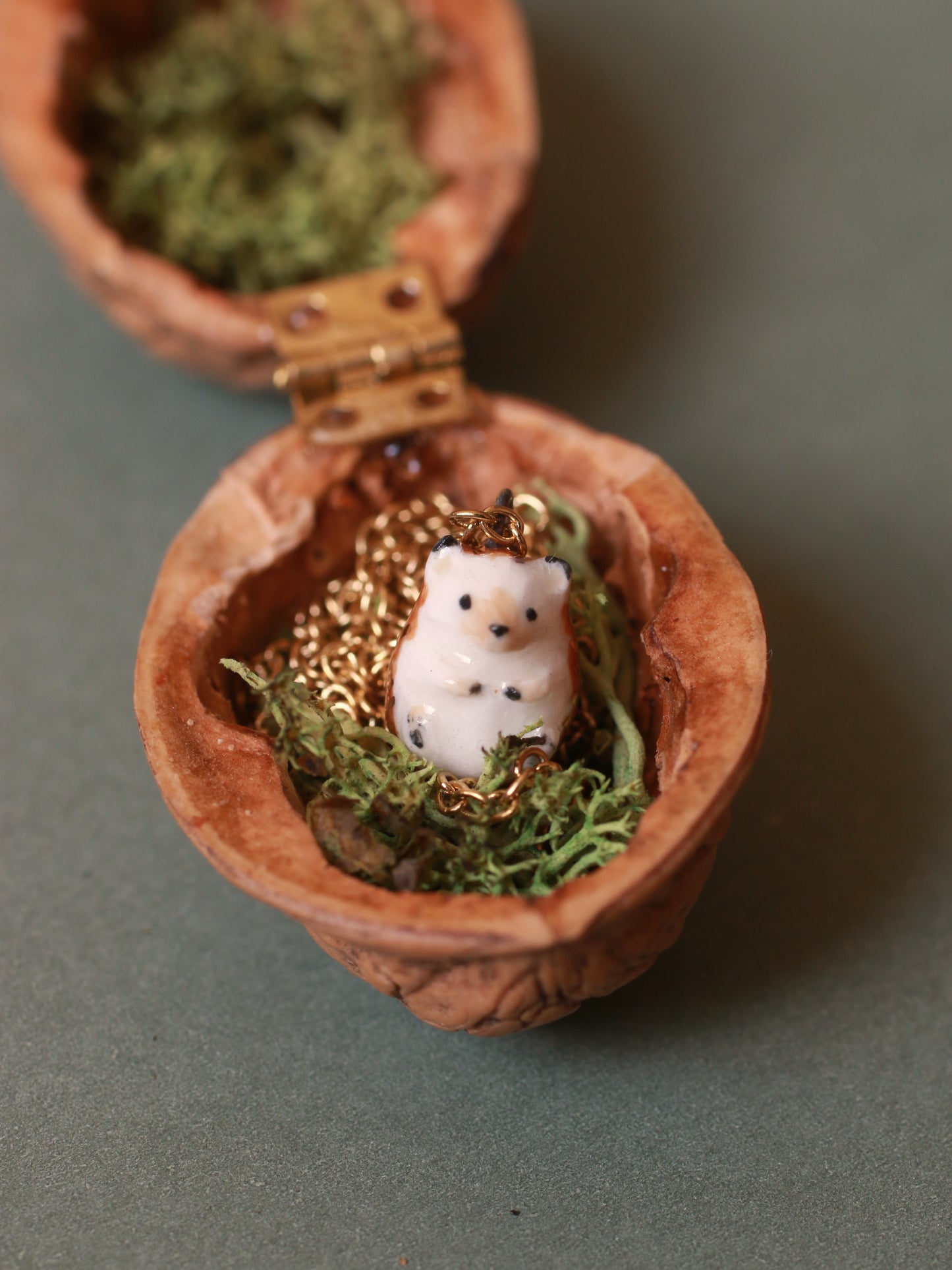 Hedgehog necklace in a walnut box