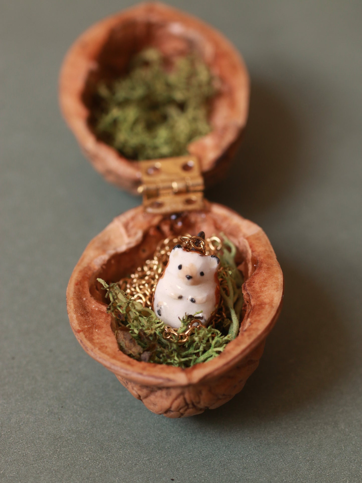 Hedgehog necklace in a walnut box