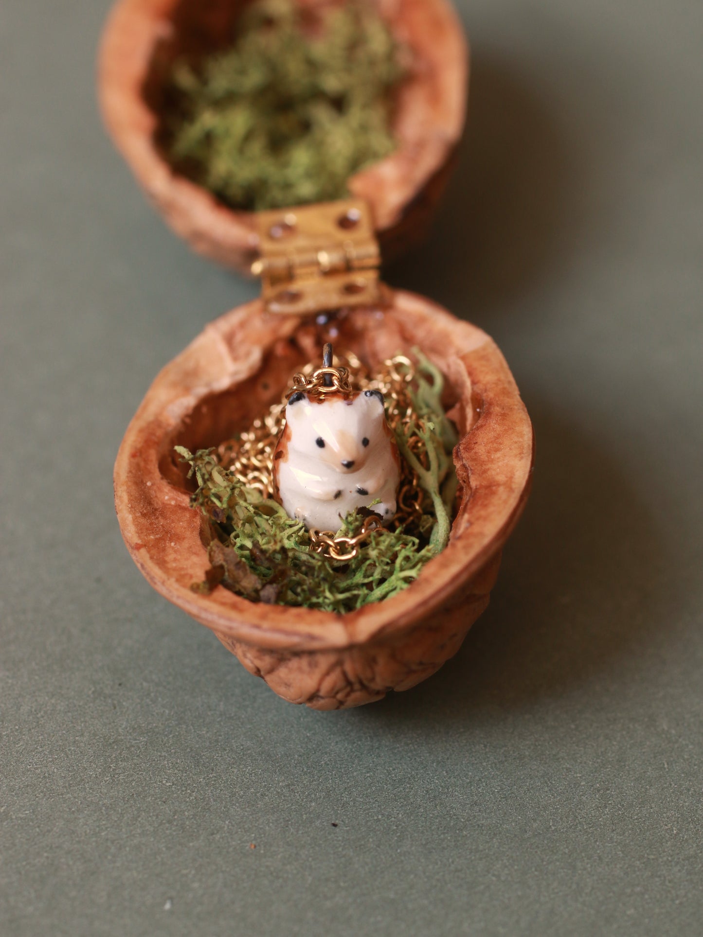 Hedgehog necklace in a walnut box