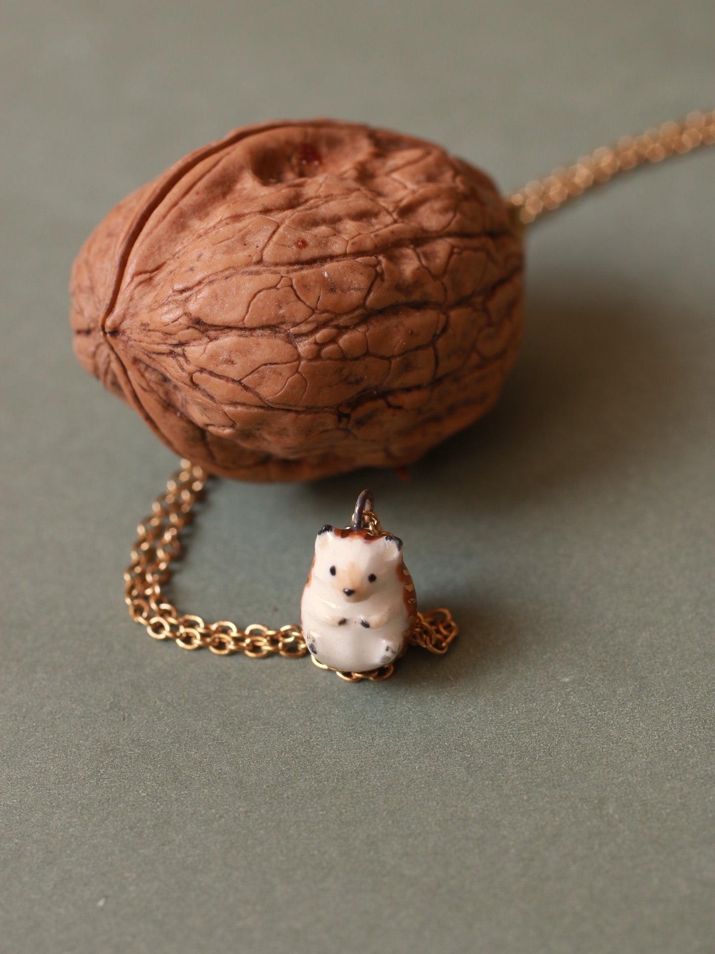 Hedgehog necklace in a walnut box