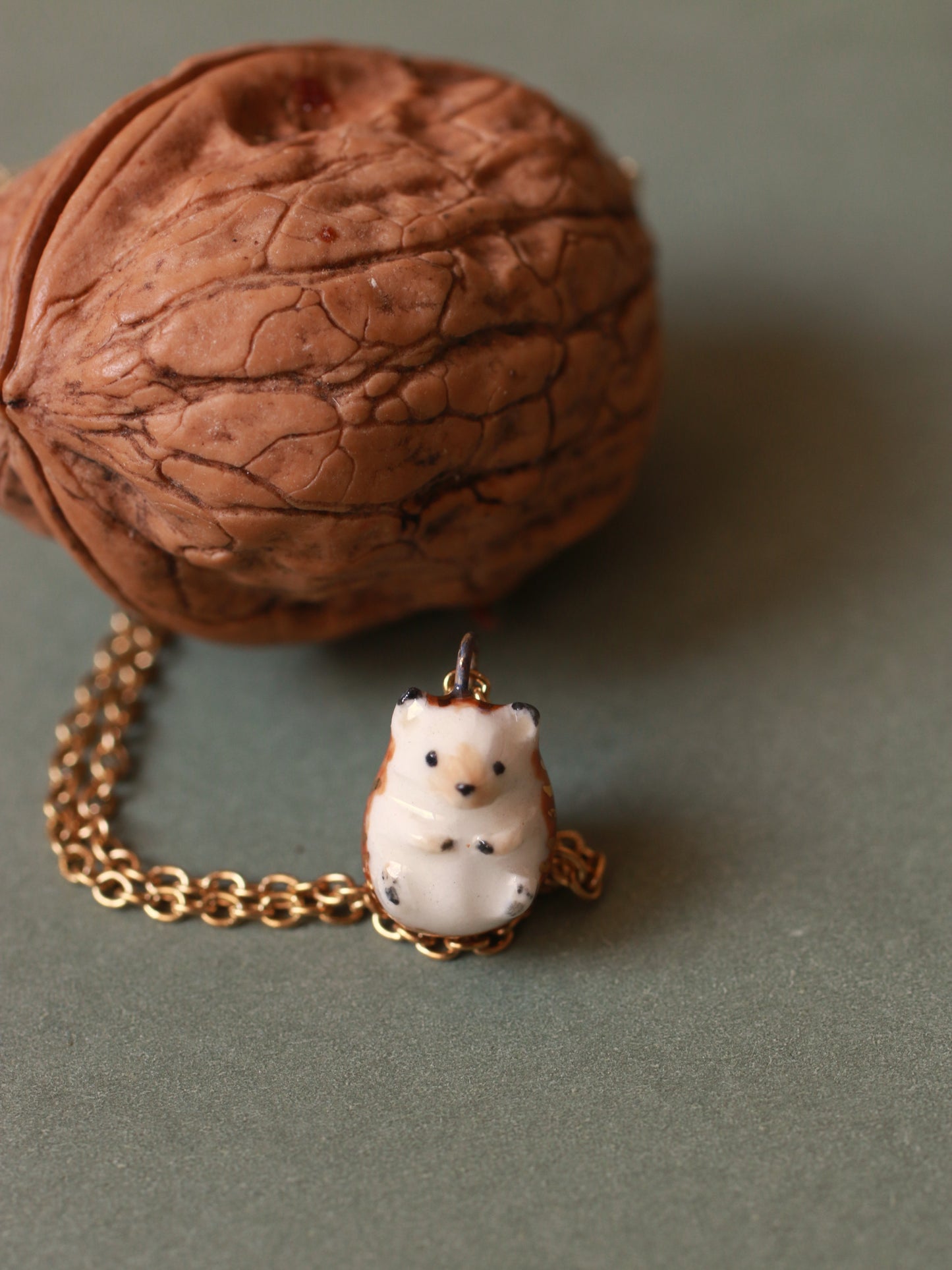Hedgehog necklace in a walnut box