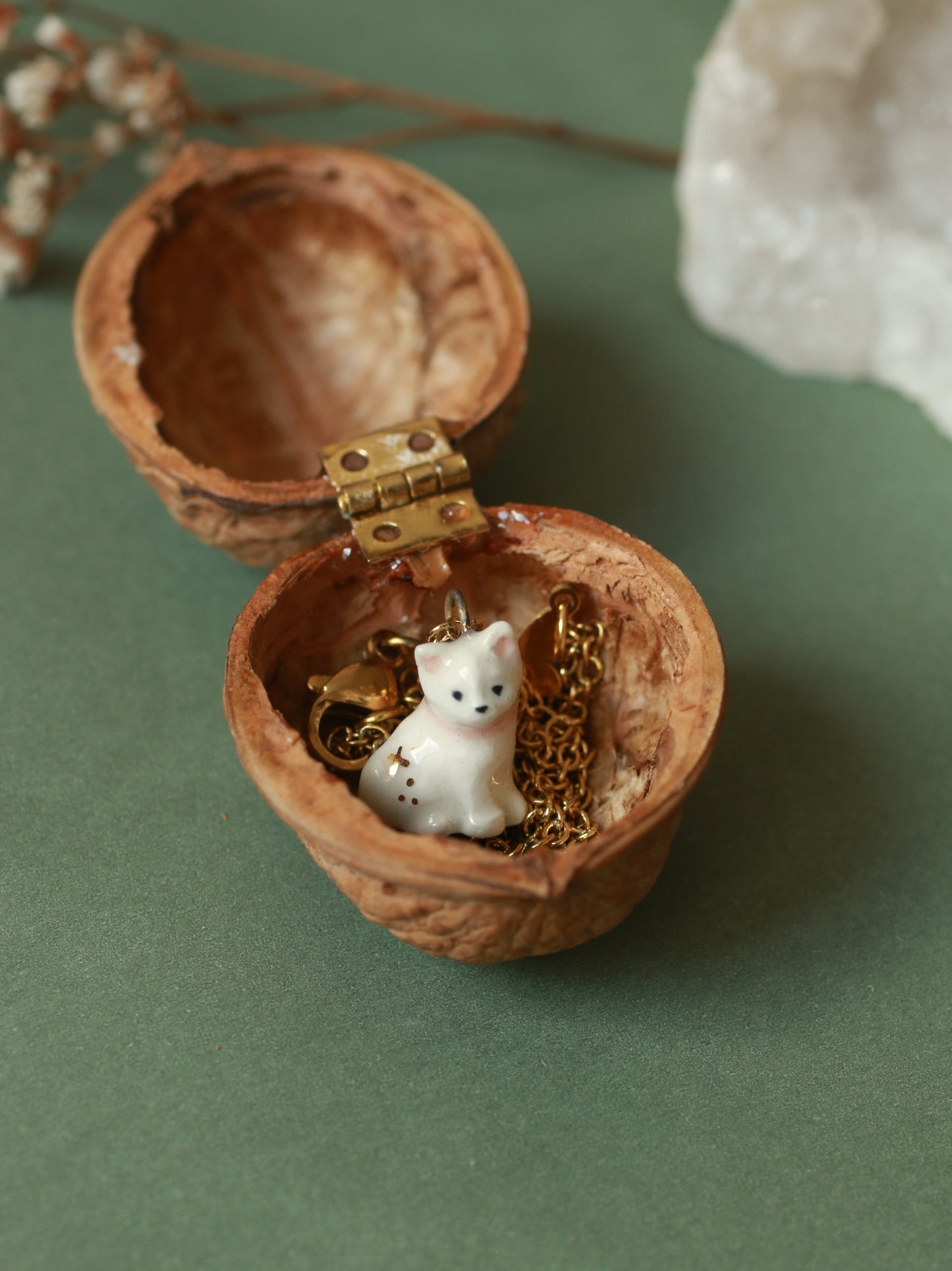Tiny white cat necklace in a walnut box