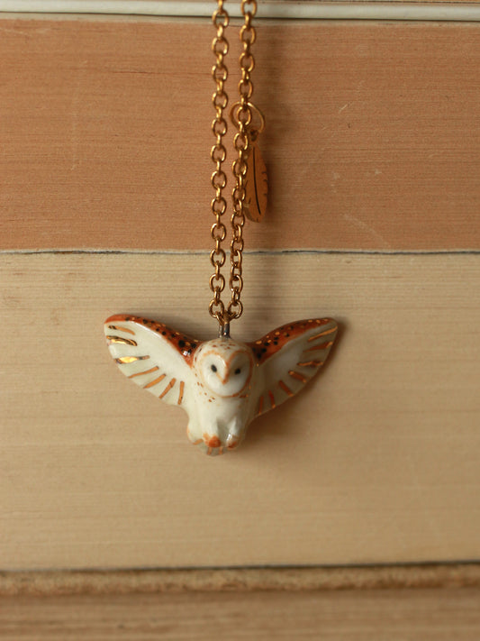 Barn owl necklace with a feather charm