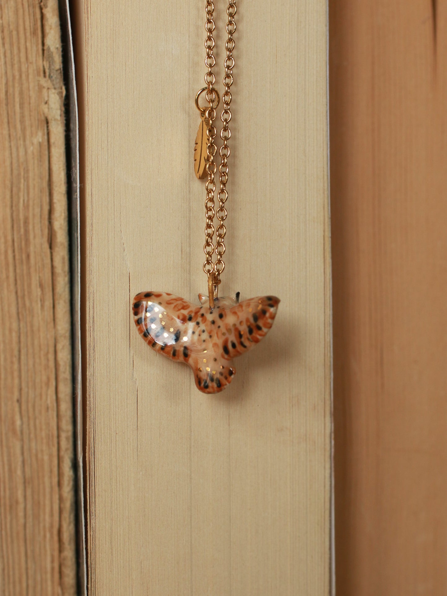 Eagle owl necklace with a feather charm