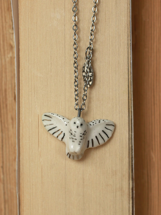 Snowy owl necklace with a feather charm