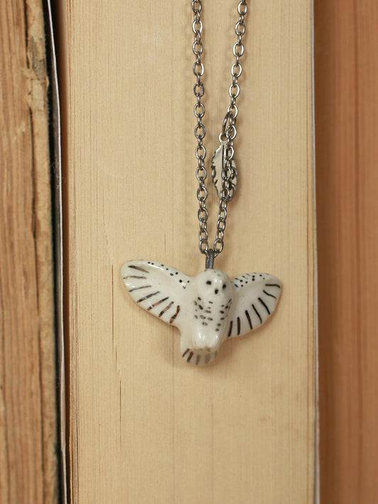 Snowy owl necklace with a feather charm