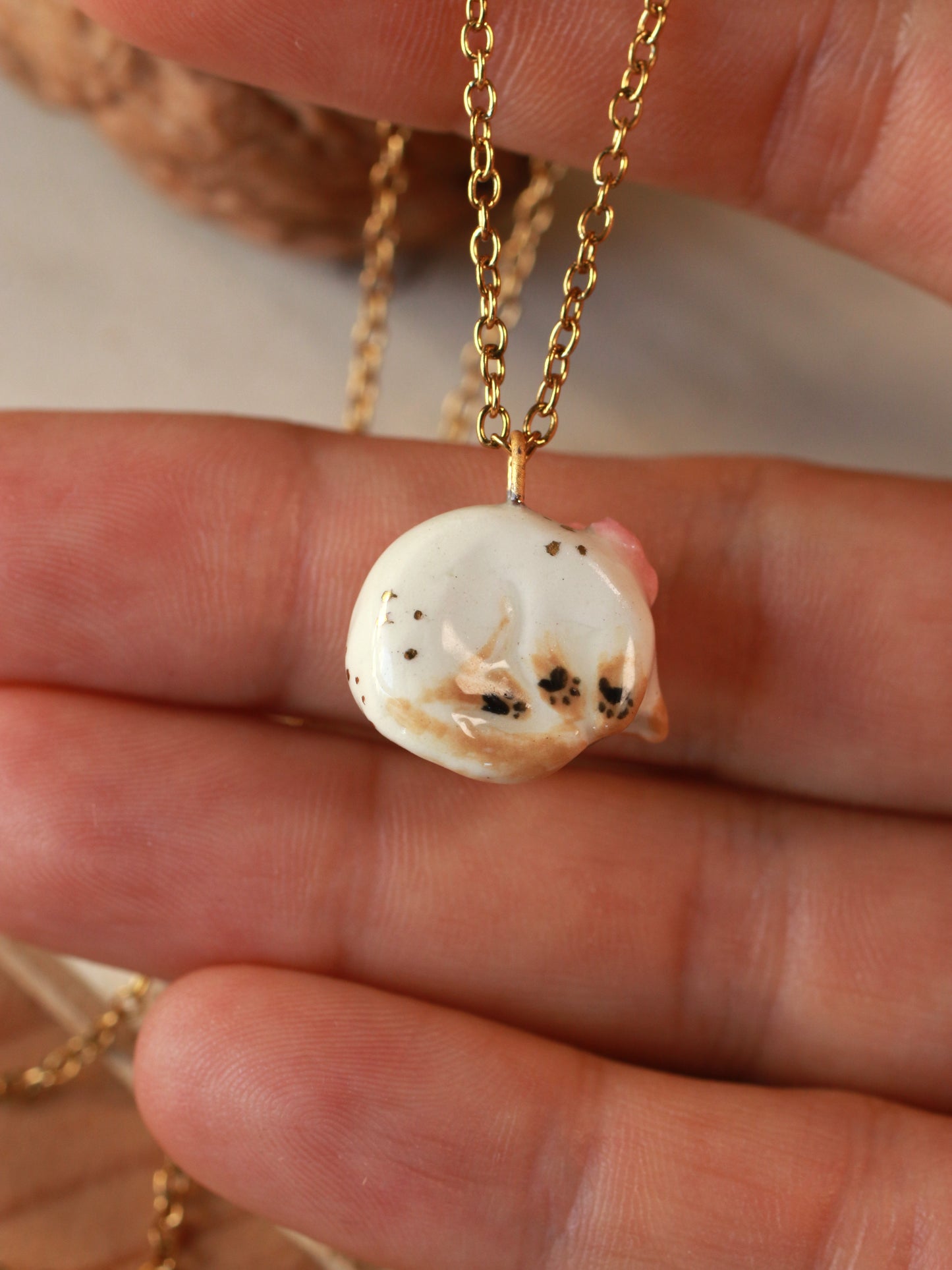 Sleeping cat necklace in a walnut box