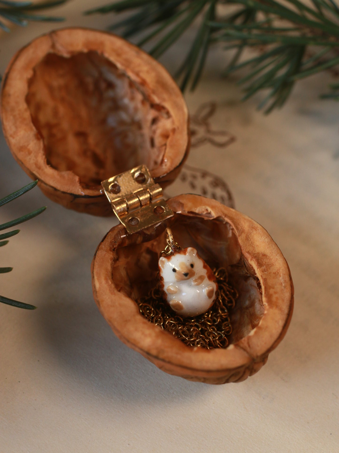 Hedgehog necklace in a walnut box