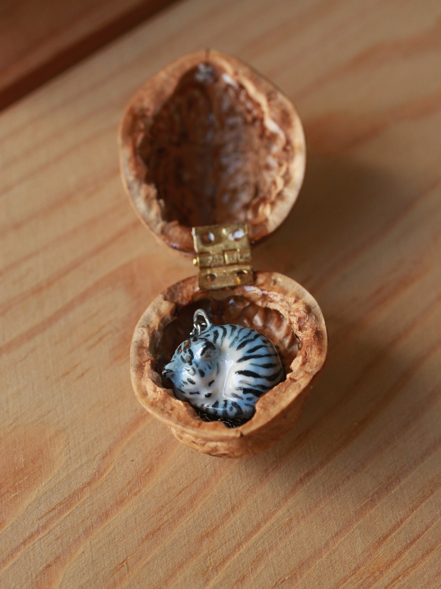 Sleeping grey tabby cat necklace in a walnut box