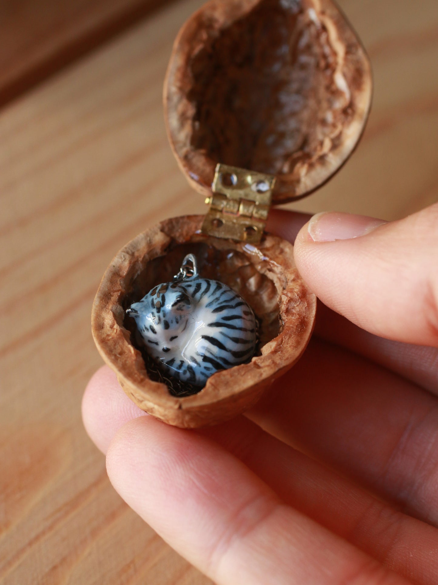 Sleeping grey tabby cat necklace in a walnut box