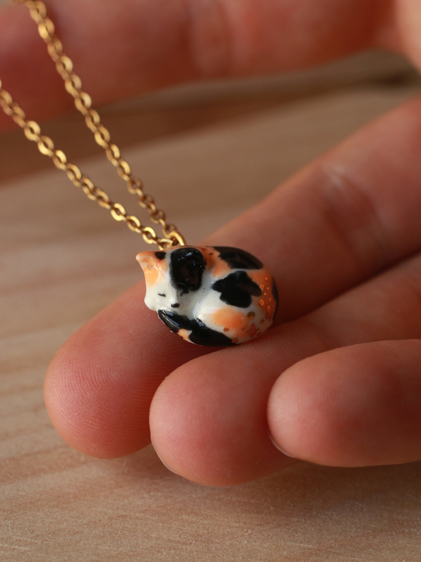Sleeping calico cat necklace