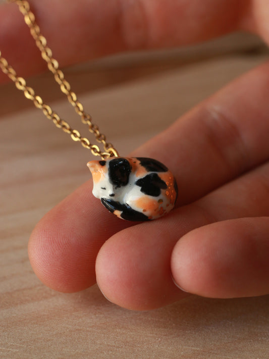 Sleeping calico cat necklace