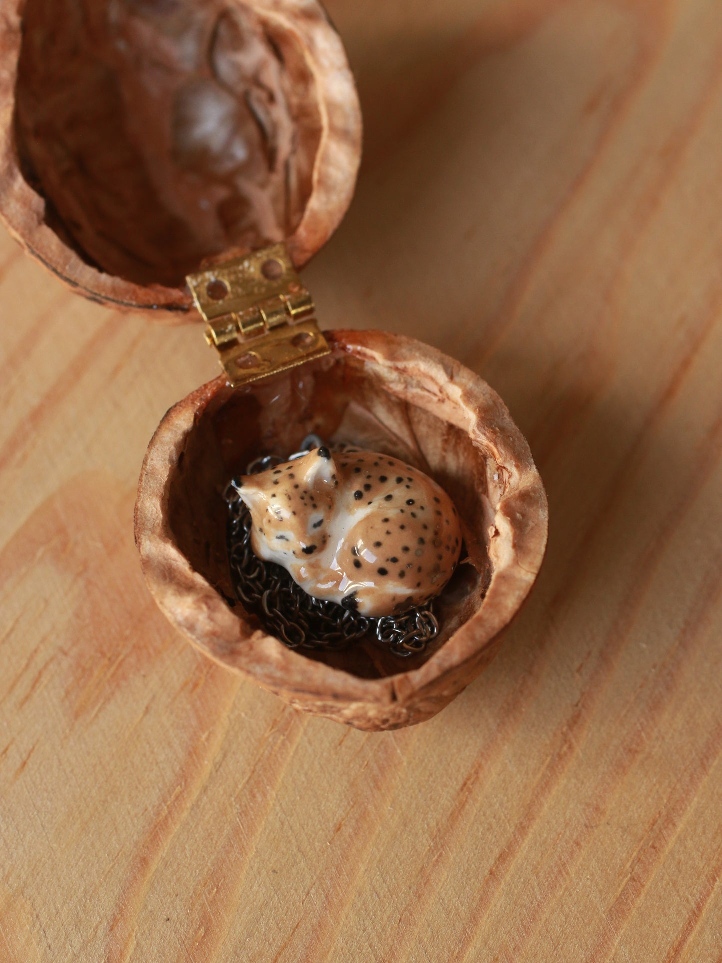 Sleeping Lynx necklace in a walnut box