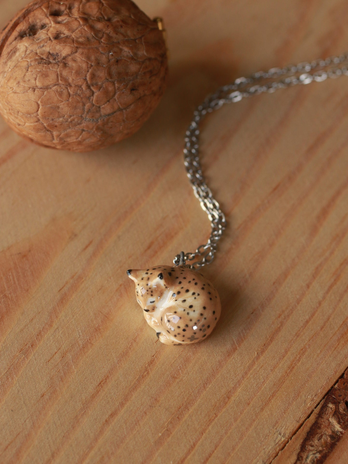 Sleeping Lynx necklace in a walnut box