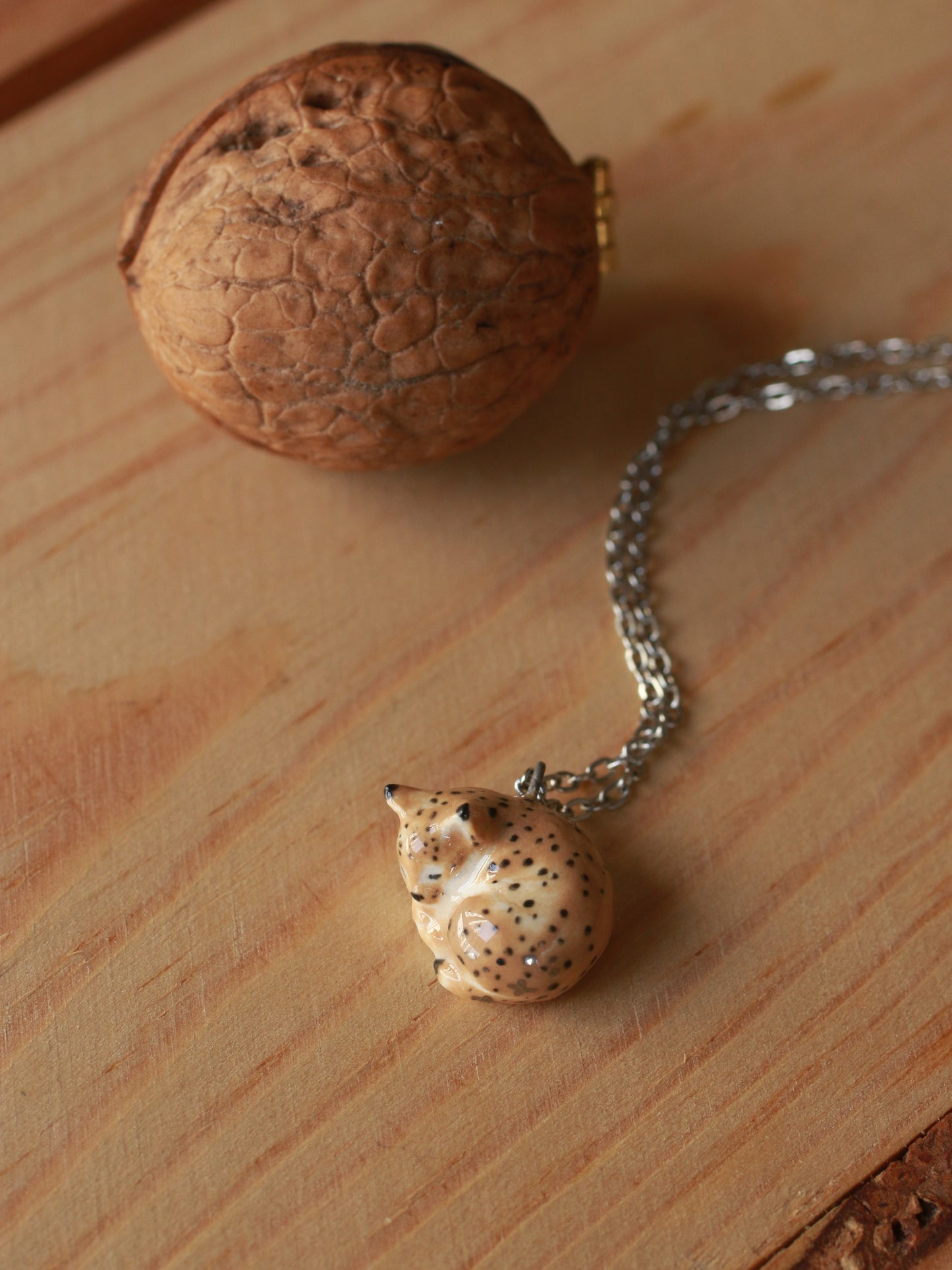 Sleeping Lynx necklace in a walnut box
