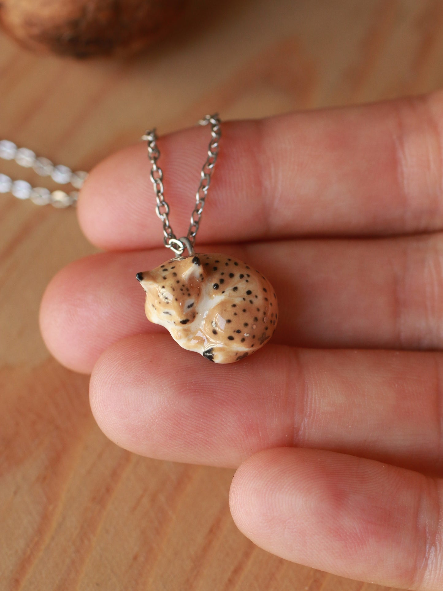 Sleeping Lynx necklace in a walnut box