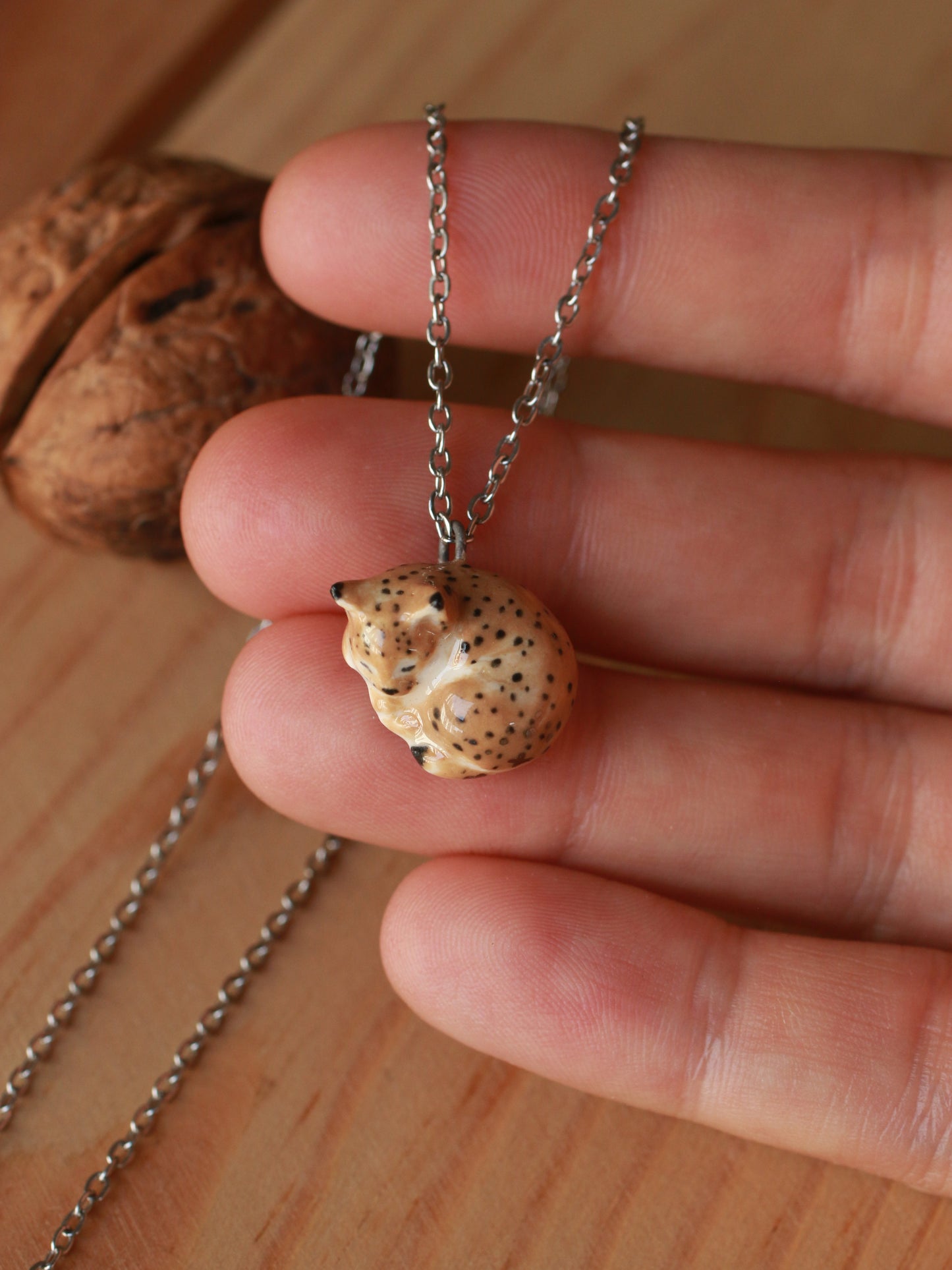 Sleeping Lynx necklace in a walnut box