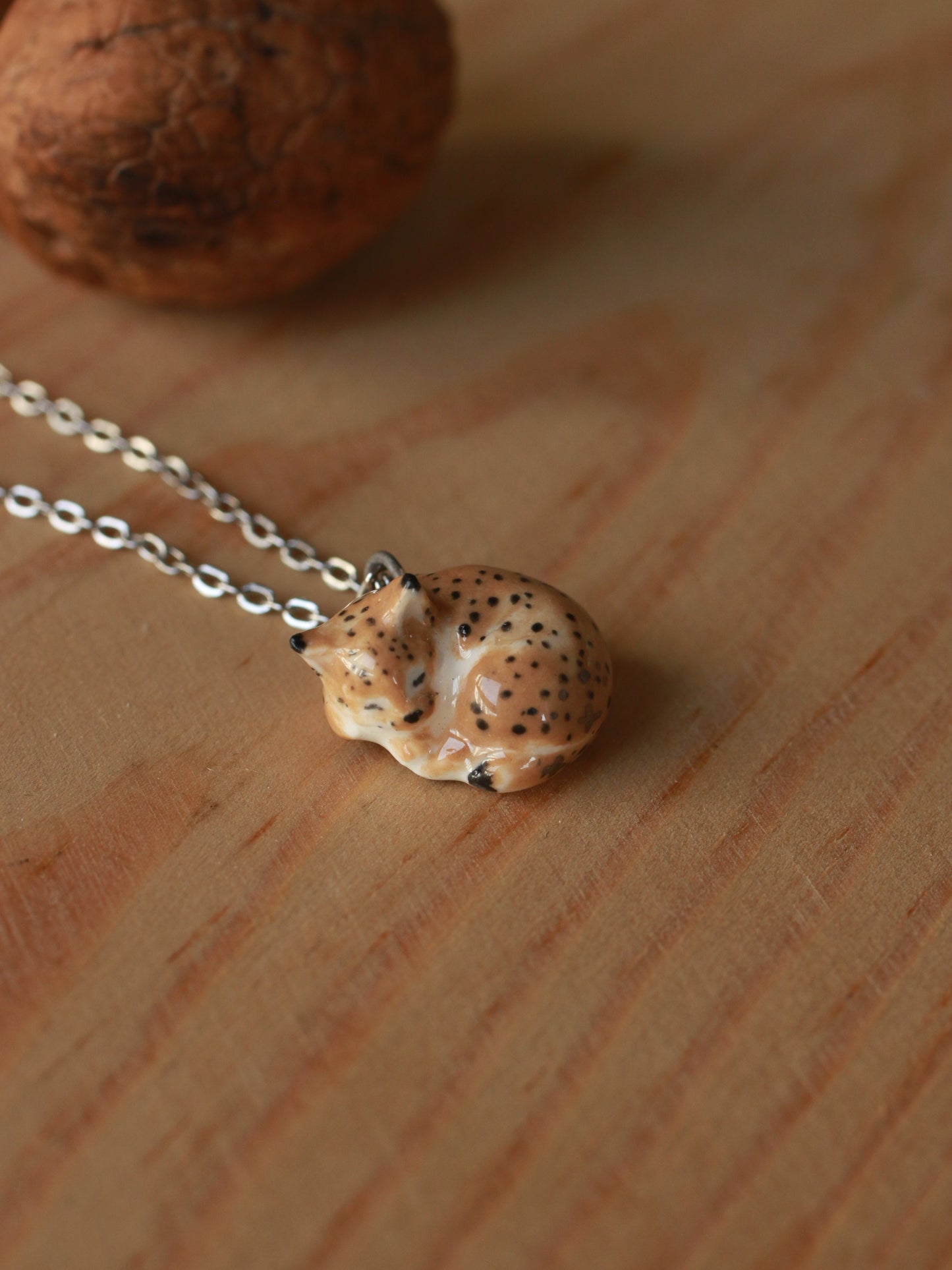 Sleeping Lynx necklace in a walnut box