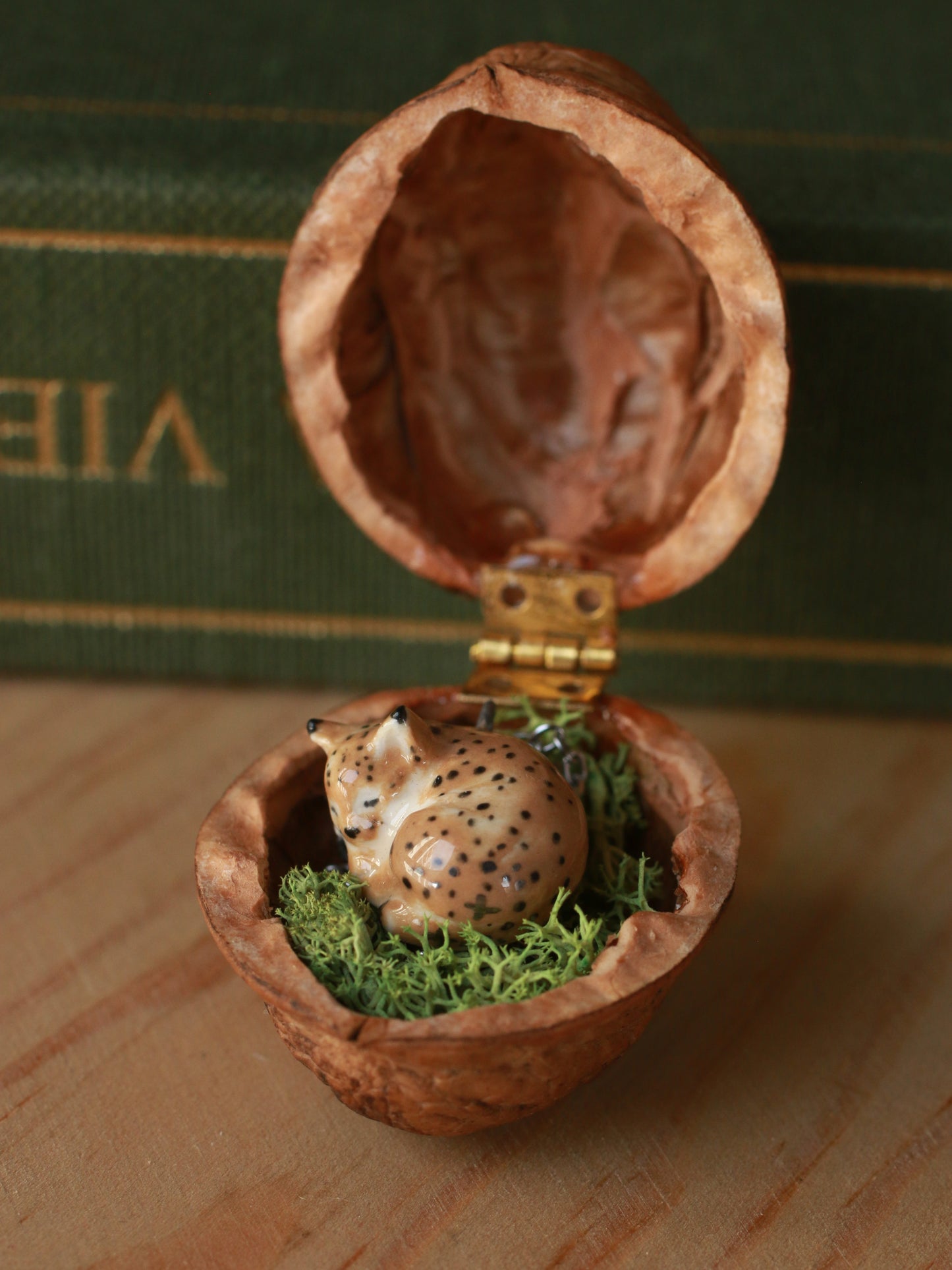 Sleeping Lynx necklace in a walnut box