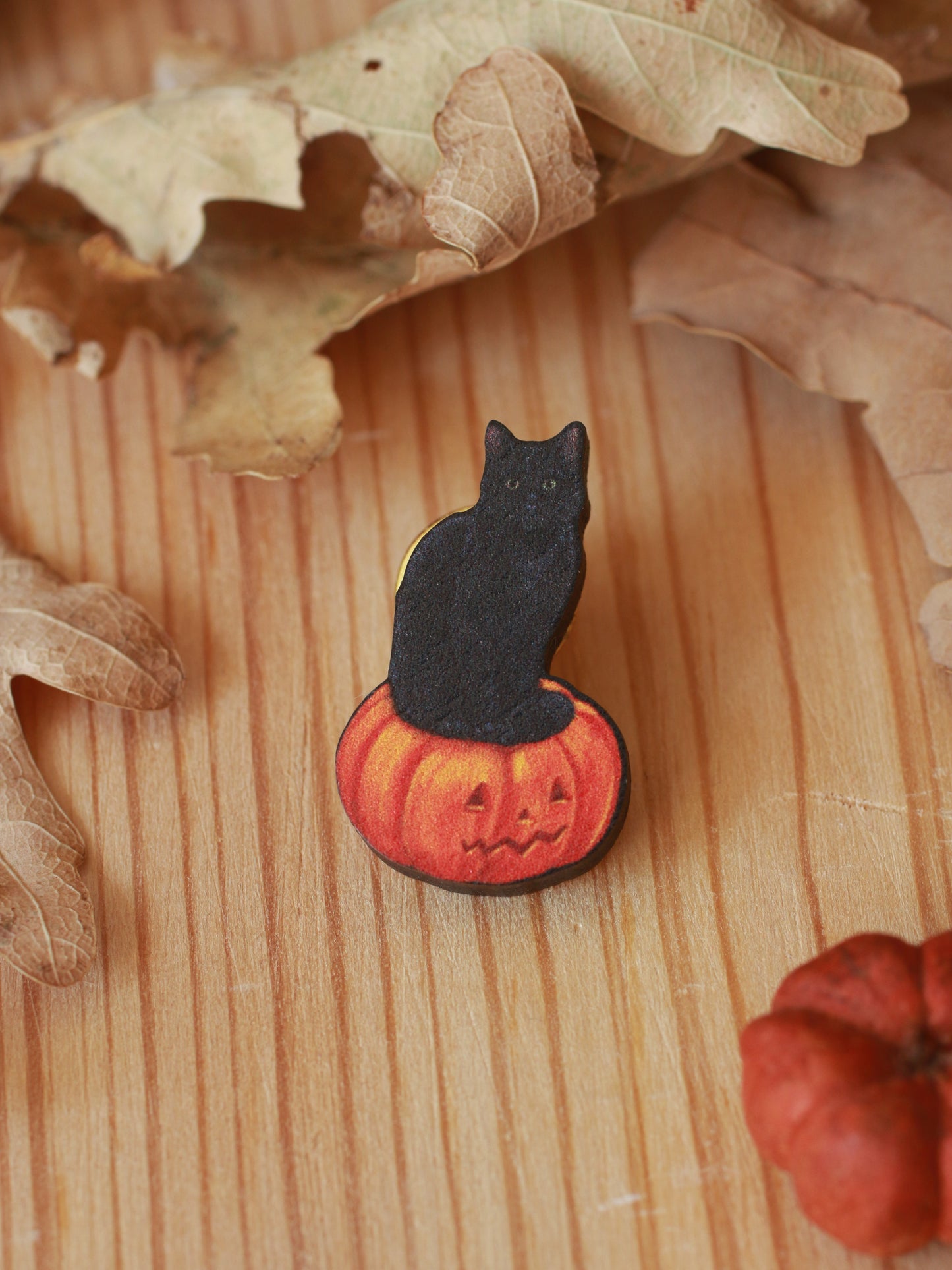 Black cat on a Jack-o'-Lantern wooden pin