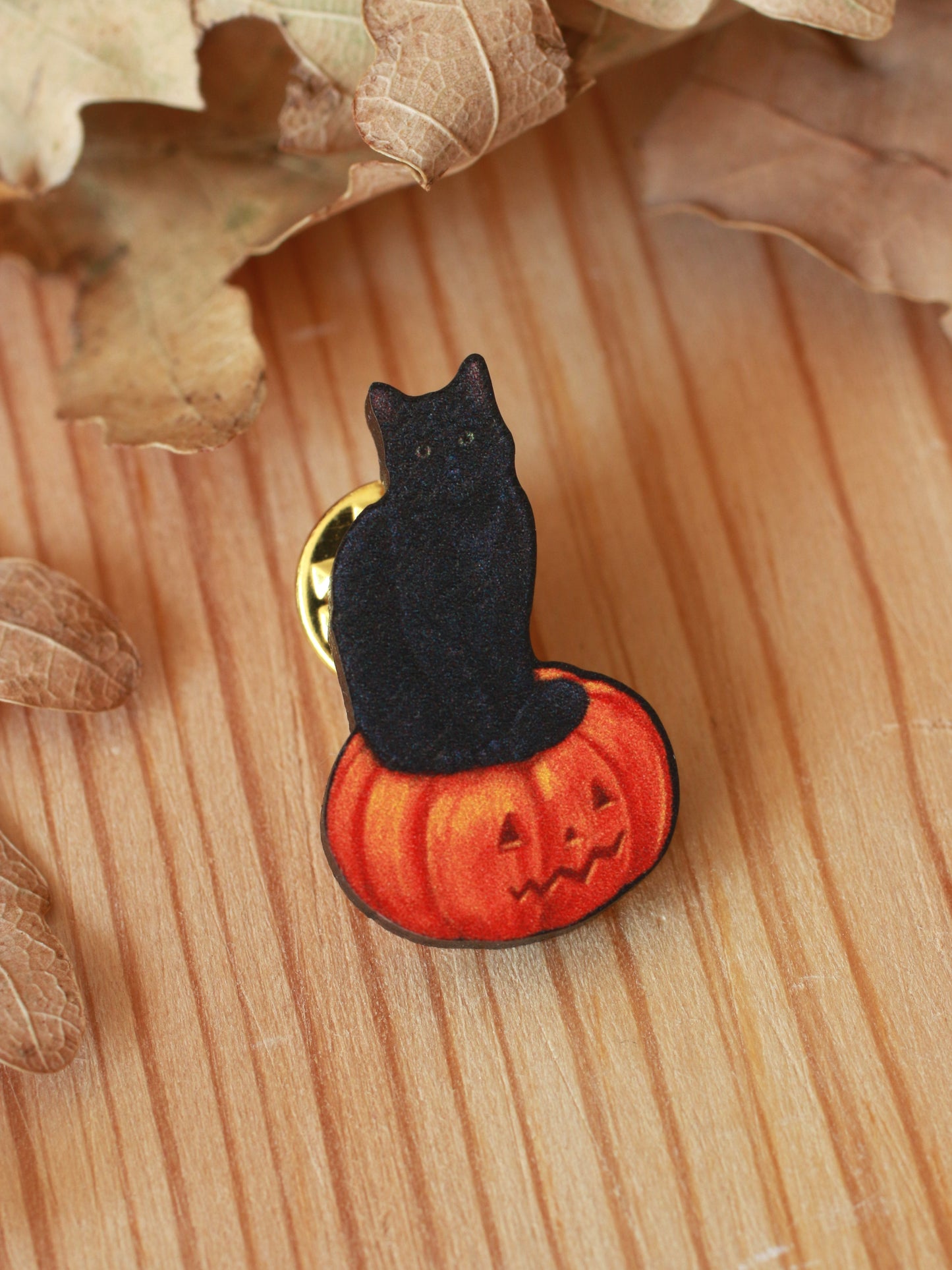 Black cat on a Jack-o'-Lantern wooden pin