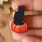 Black cat on a Jack-o'-Lantern wooden pin