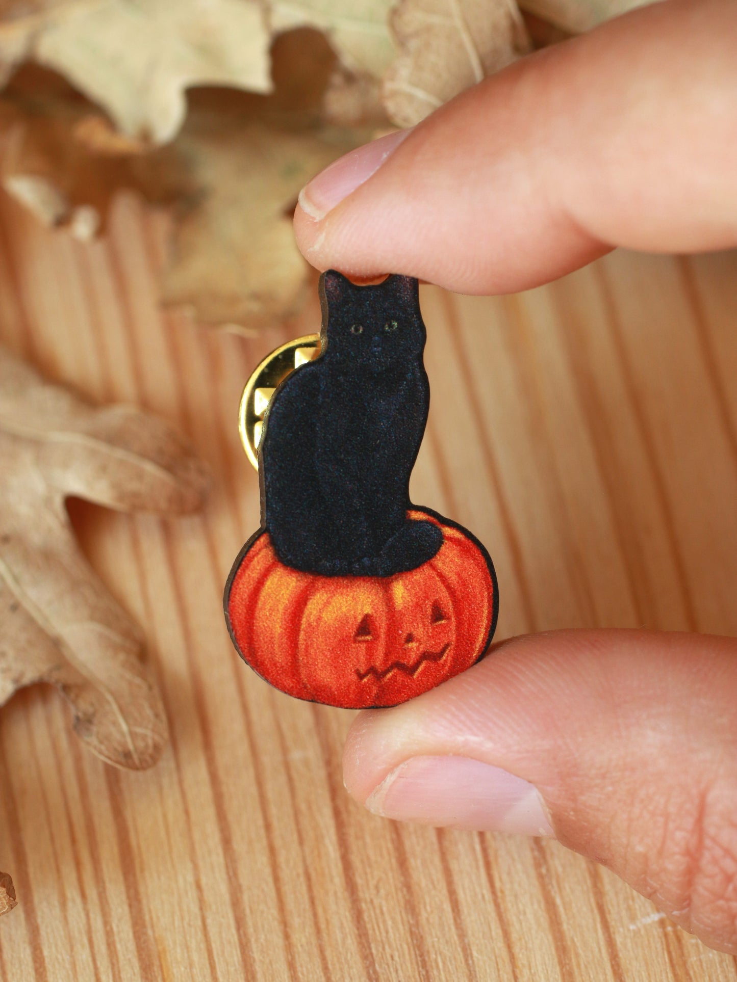 Black cat on a Jack-o'-Lantern wooden pin