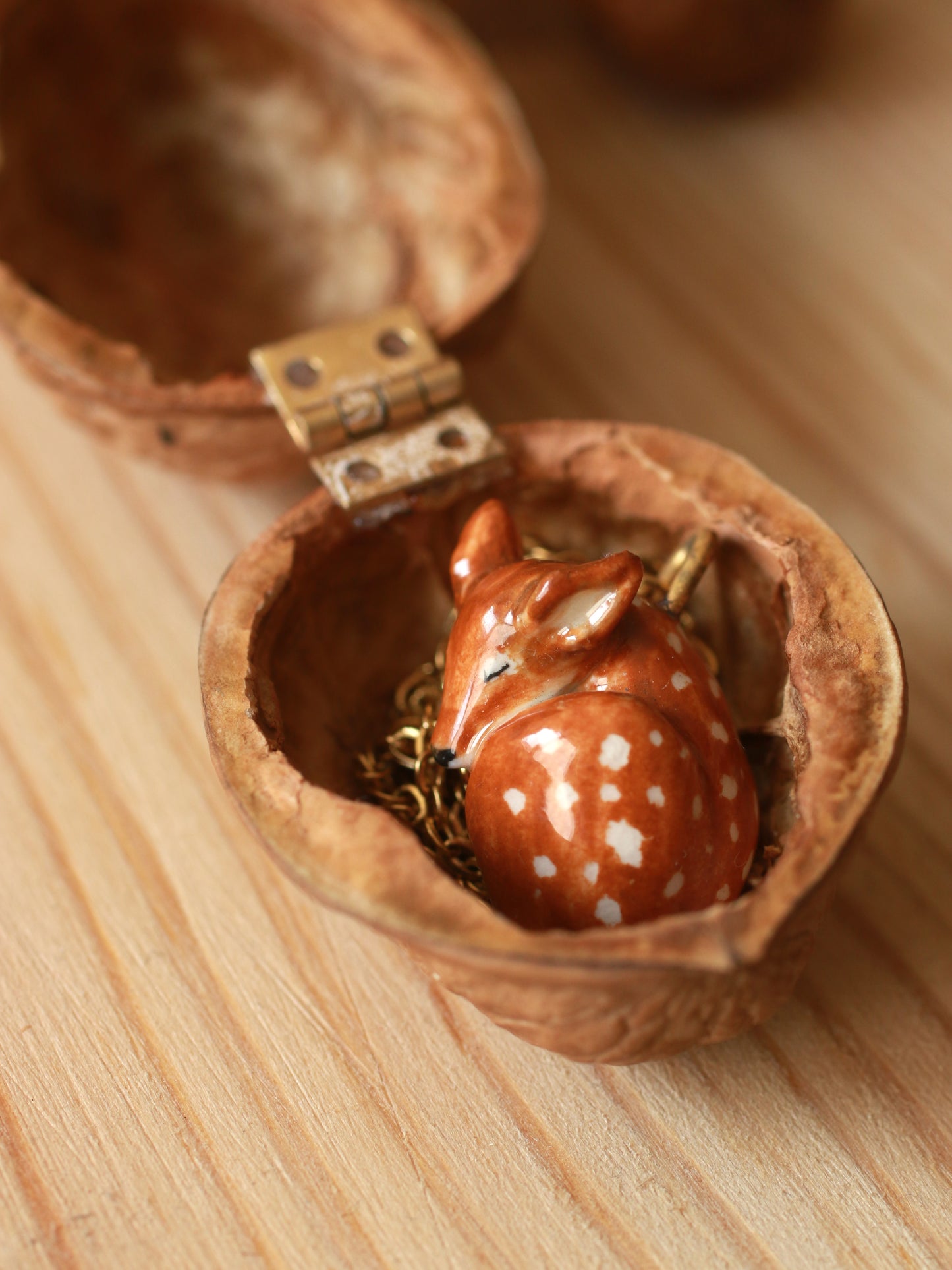 Sleeping Fawn necklace in a walnut box