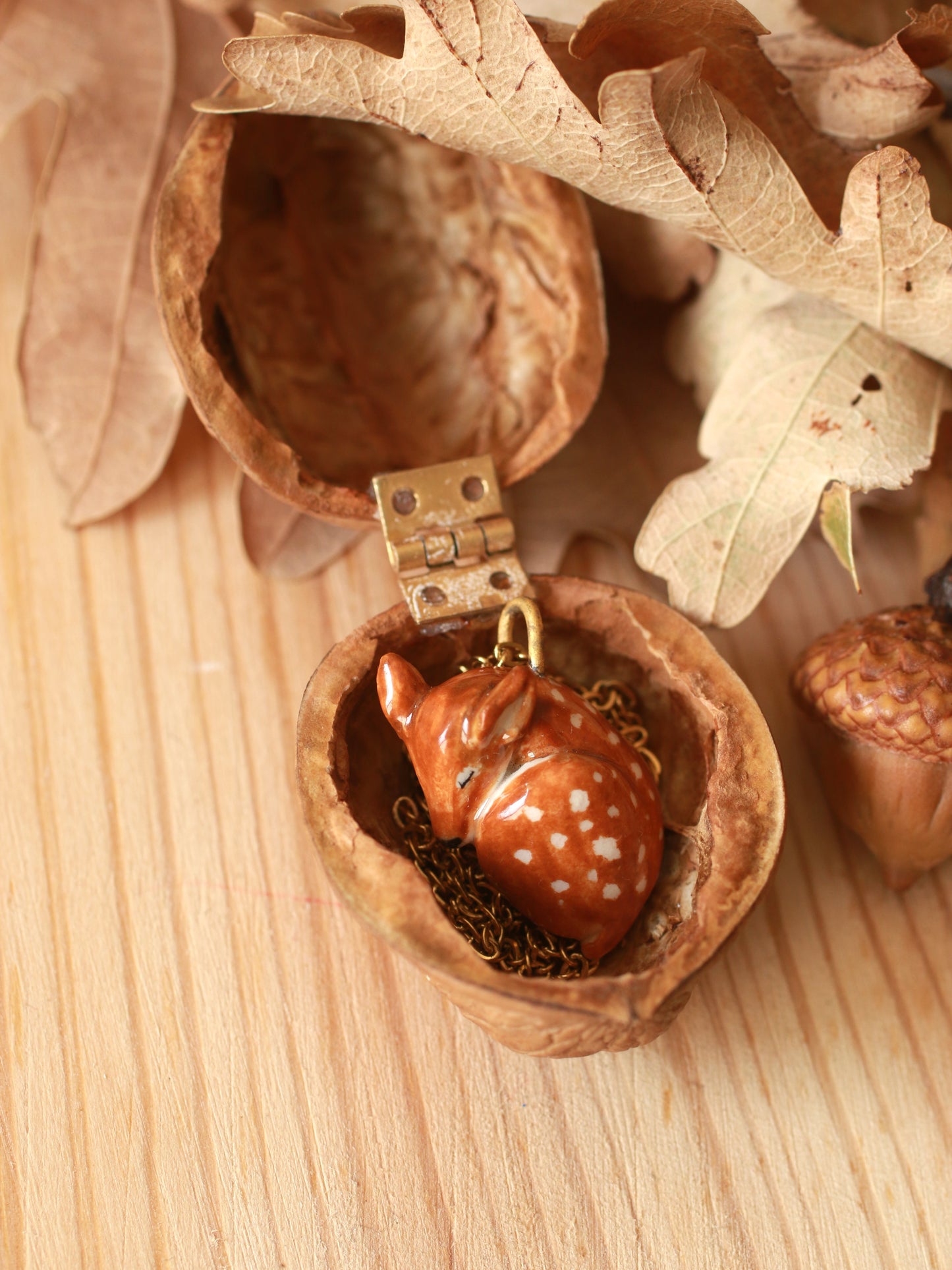 Sleeping Fawn necklace in a walnut box