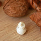 Baby barn owl figure in a walnut box