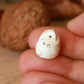 Baby barn owl figure in a walnut box